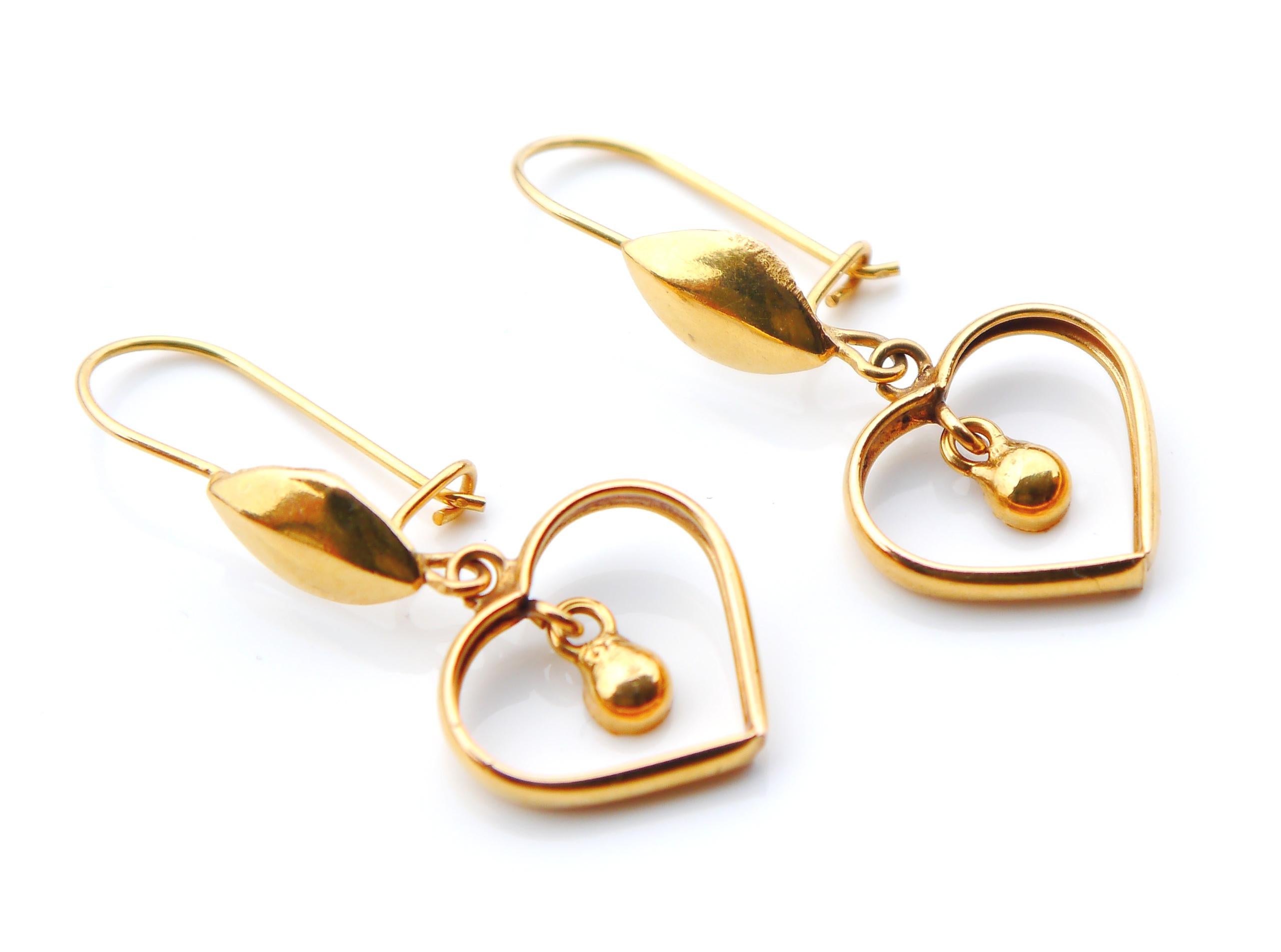 A pair of custom - made Hearts Dangles in solid 21K Yellow Gold. 

Europe or Middle East, ca. 1950s -1960s. No hallmarks, metal tested solid 20/ 21K Gold.

Each earring is 23 mm long. Each heart 14 mm x 14 mm at axes. Weight: 2.3