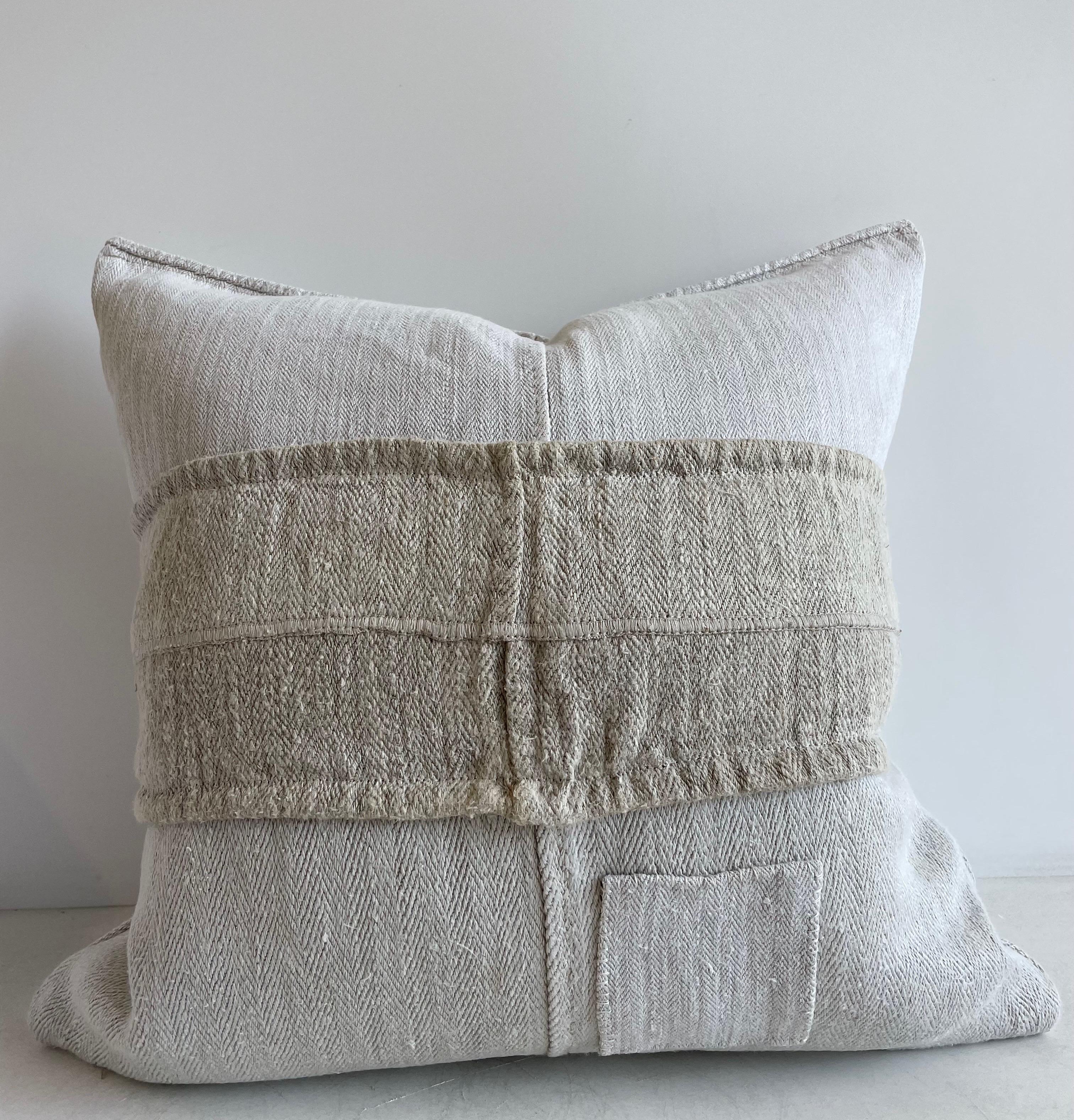 Antique grain sack pillow. Lovely grain feed sack pillows from Europe. We custom-made these out of the original antique feed sacks, with brass zipper closure and overlocked edges. All items have been pre washed, clean and ready to use. Condition: