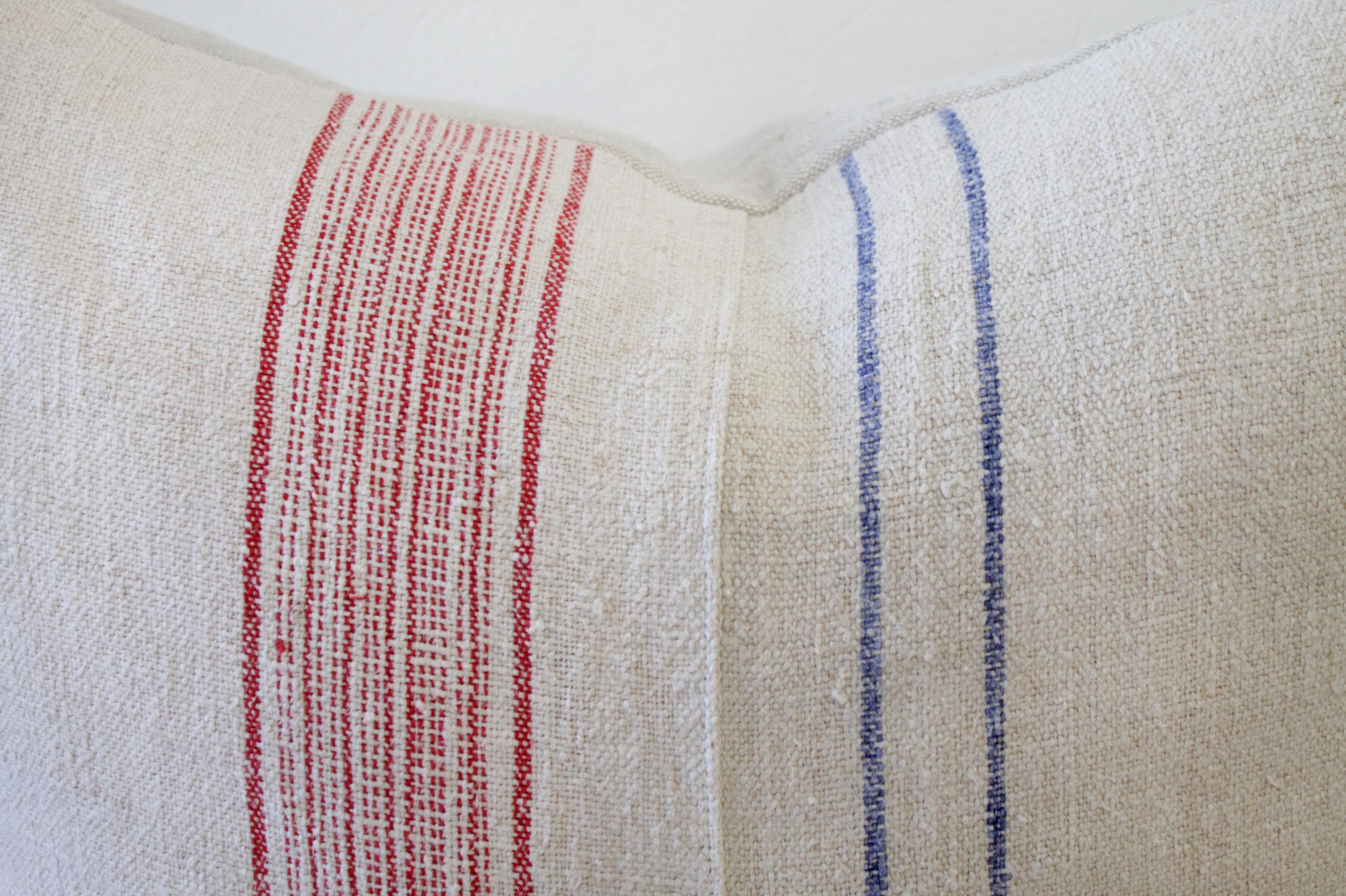 Vintage European grain sack pillows, custom made with a patchwork design. Oatmeal colored background, with red/blue stripes, and hidden zipper closure. Some grain sacks have original patchwork, and stitching. Please see photos. Insert not included,