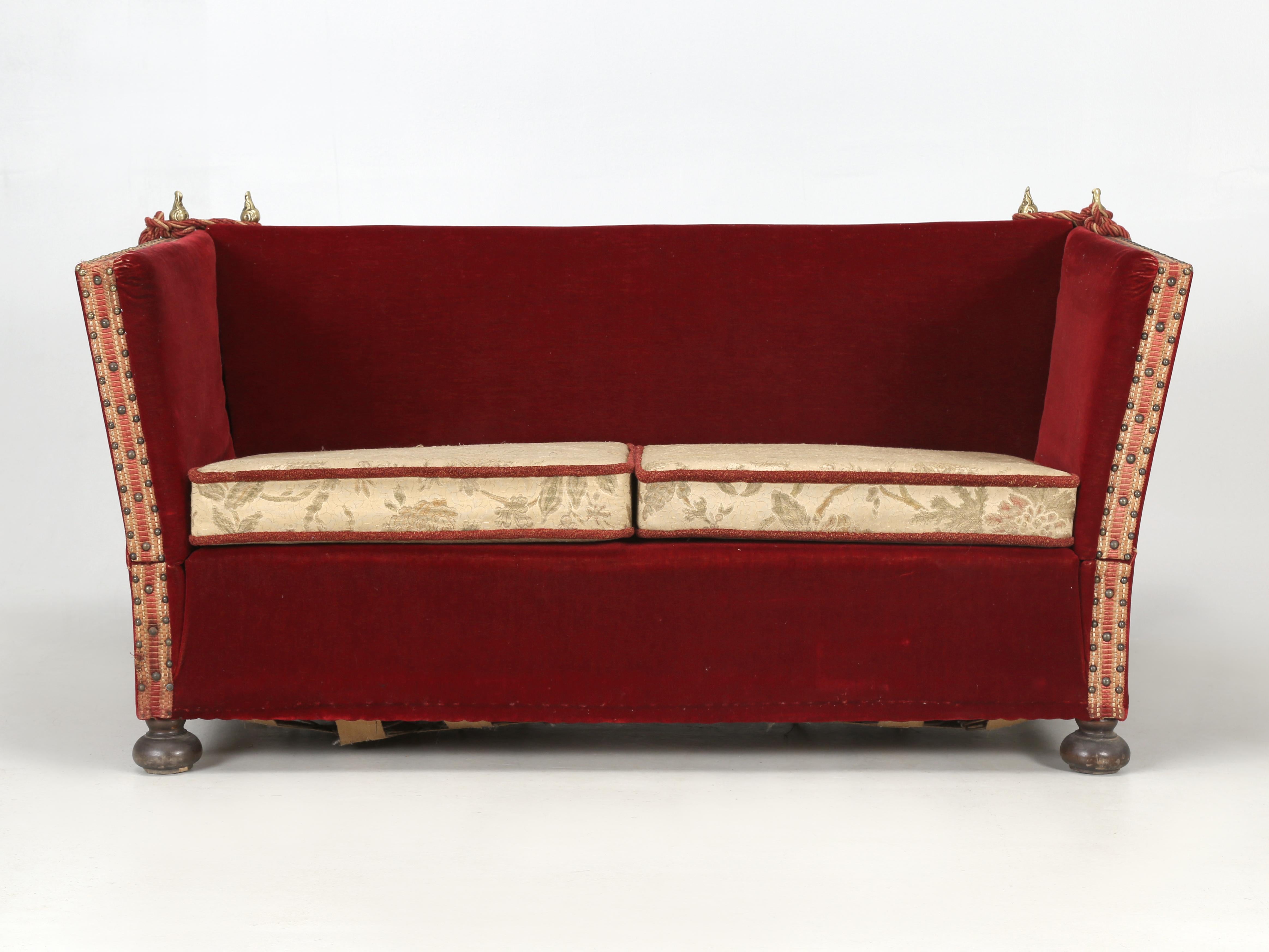 Vintage Knole settee that did not originate with from the Knoll furniture company, but rather from the Knole house in County Kent. The original Knole sofa or settee was designed around 1640 and are still being produced today. The Knole sofa