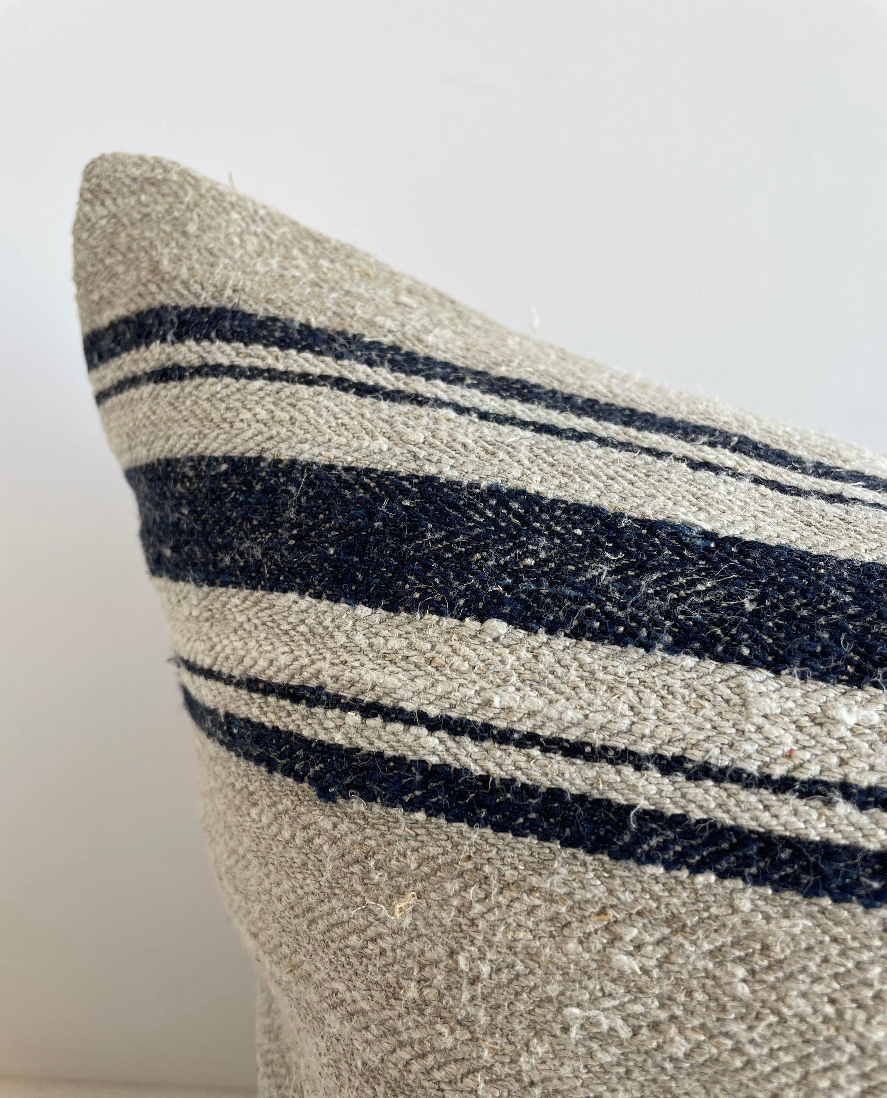 Grainsack pillows
Lovely grain feed sack pillows from Europe. We custom-made these out of the original antique feed sacks, with brass zipper closure and overlocked edges. The fronts are original woven linen and hemp with stripes in indigo and off