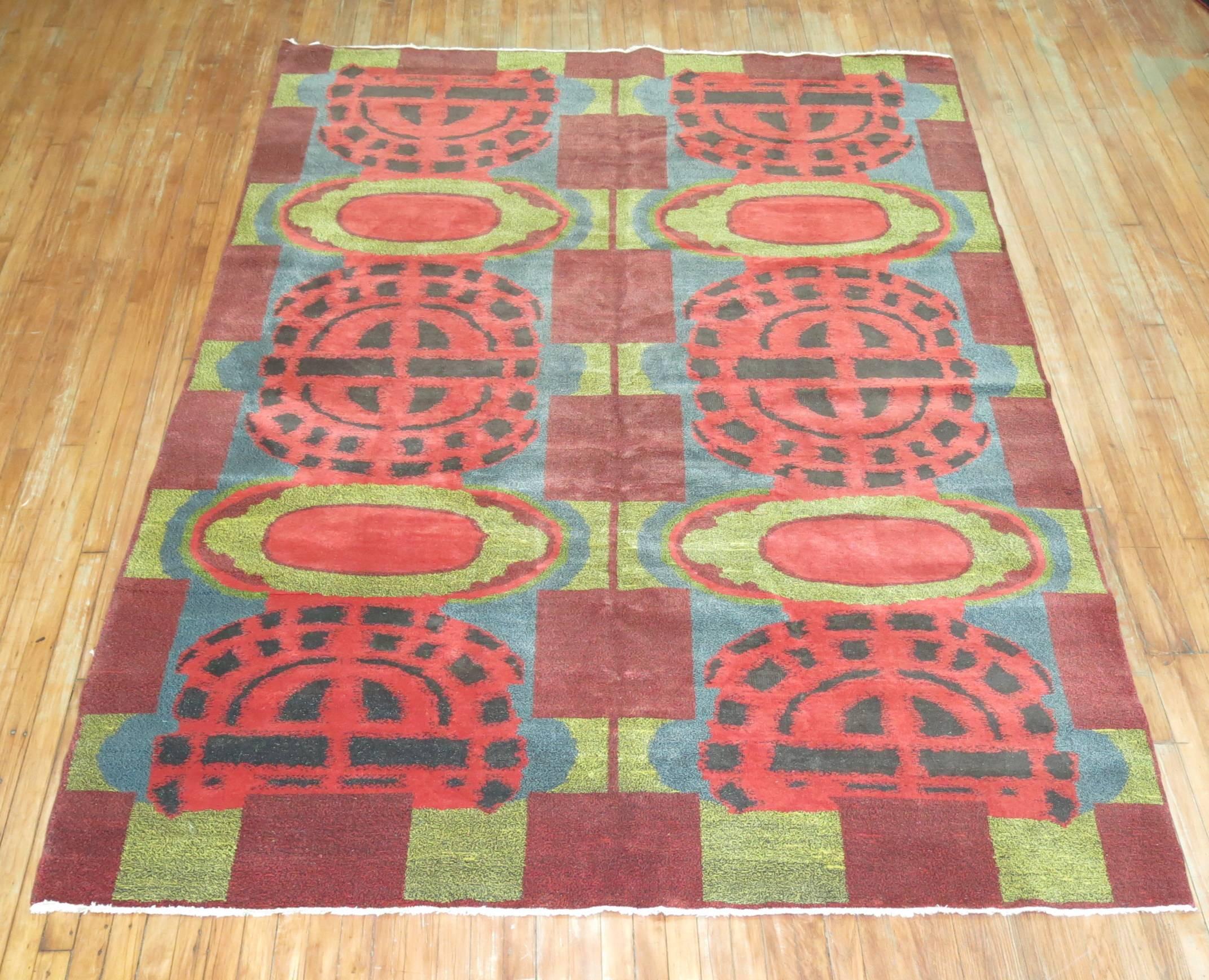 A dazzling european modernist carpet with intense colors and abstract design.