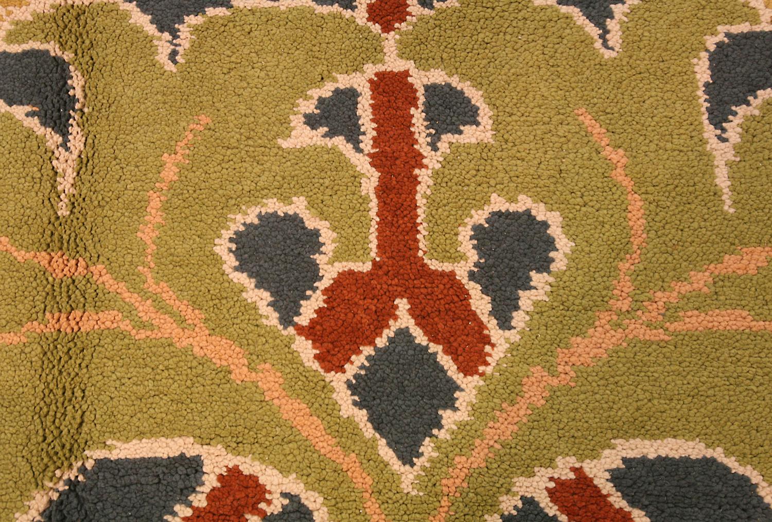 This is a hand-woven semi-antique European rug woven, circa 1950. A luxurious carpet with amazing design and enchanting color palette of Green and Beige that will amaze you. By looking closely you can genuinely enjoy the timeless elegance and charm