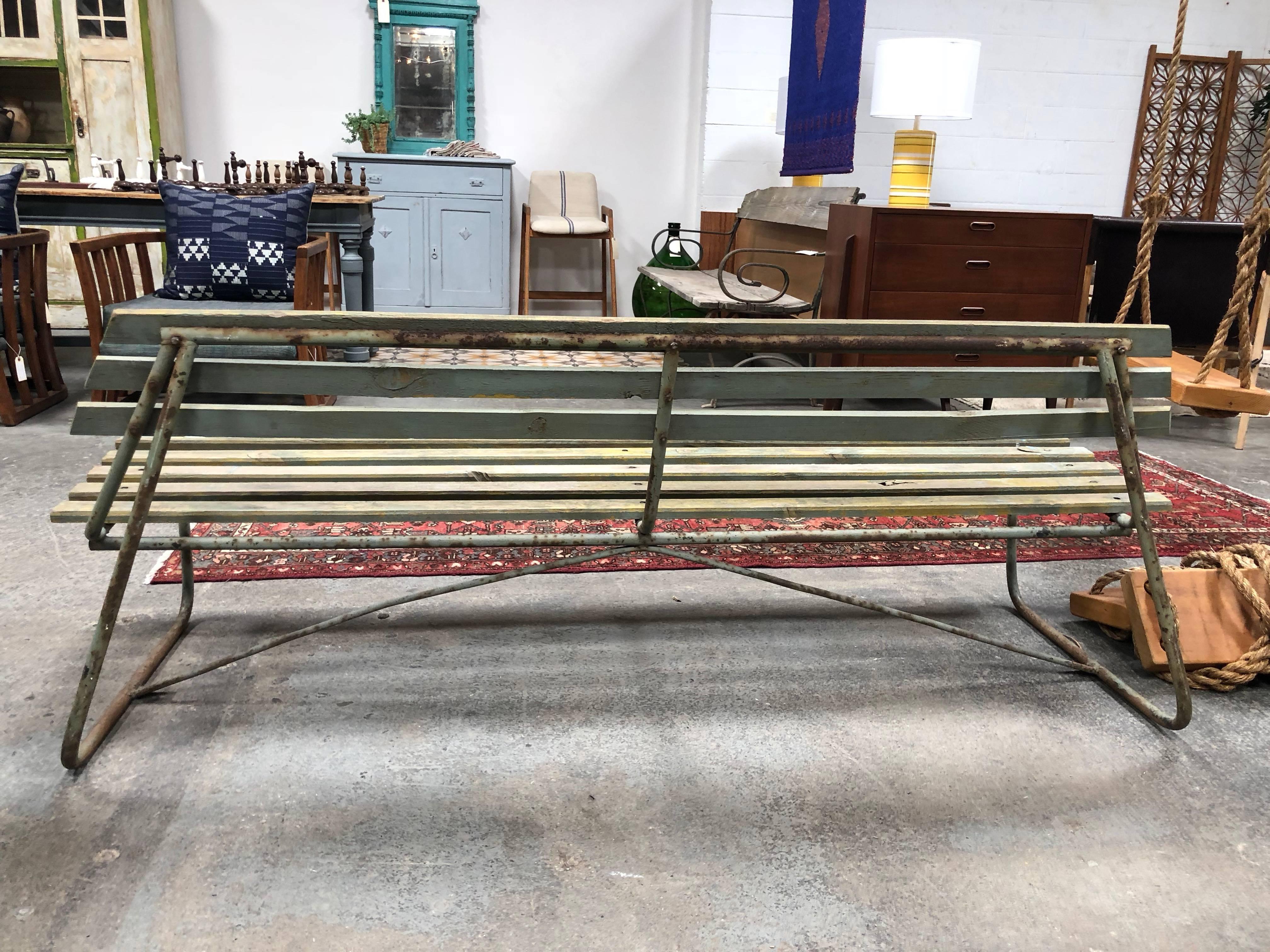 This bench is perfect for a garden or back yard seating area.
Lots of vintage charm with worn paint, wood, and metal.