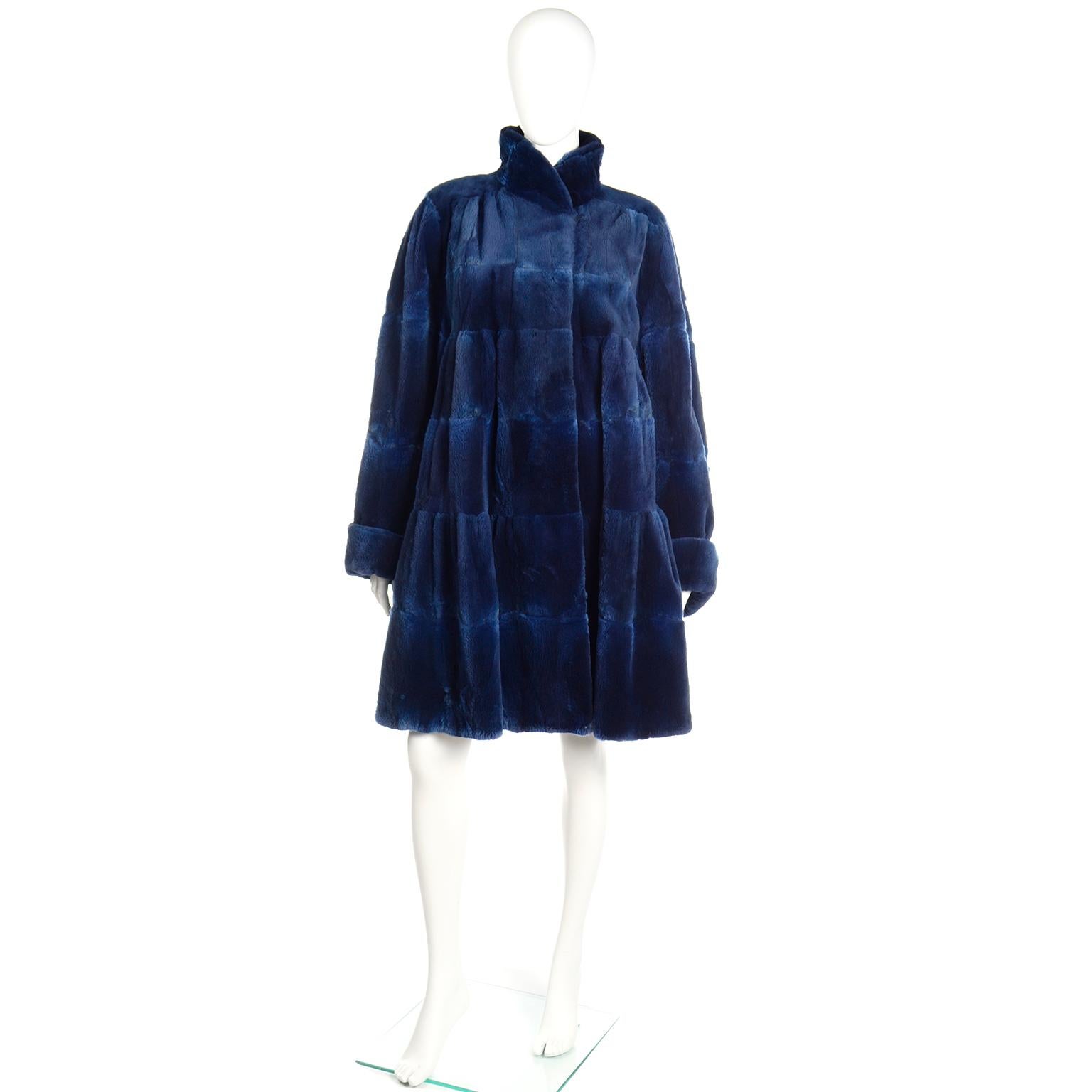 This is a really fabulous Evans Collection tiered blue sheared muskrat swing coat designed in the 1980s. This luxuriously soft vintage coat is from an estate we acquired and the original owner bought some the most beautiful designer wardrobe! This