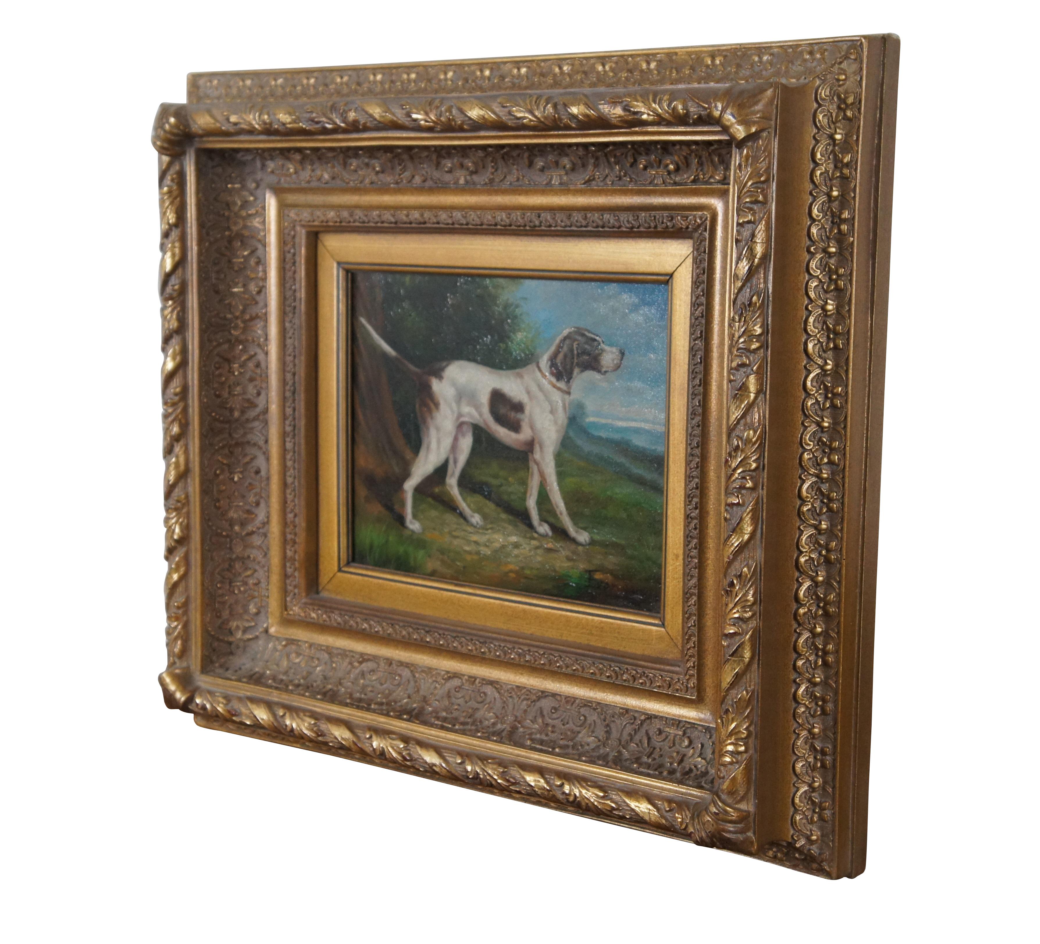 Vintage oil on canvas portrait painting of a British style hunting dog – appears to be a foxhound or pointer – standing in an idyllic landscape. Set in an antique style intricately carved and deeply beveled giltwood frame. Signed Evans in lower