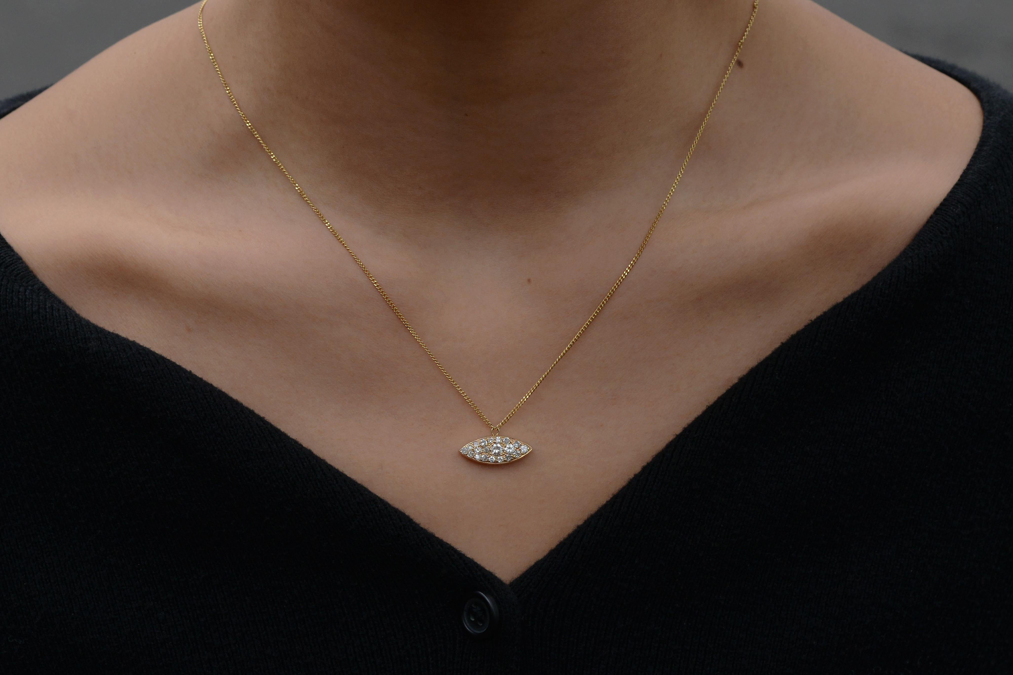 This exclusive vintage diamond necklace is perfect for those who appreciate luxurious jewelry with a sustainable, eco-friendly conscience. Made with enduring 14 karat yellow gold and over a half carat of shimmering diamonds. A flourishing estate