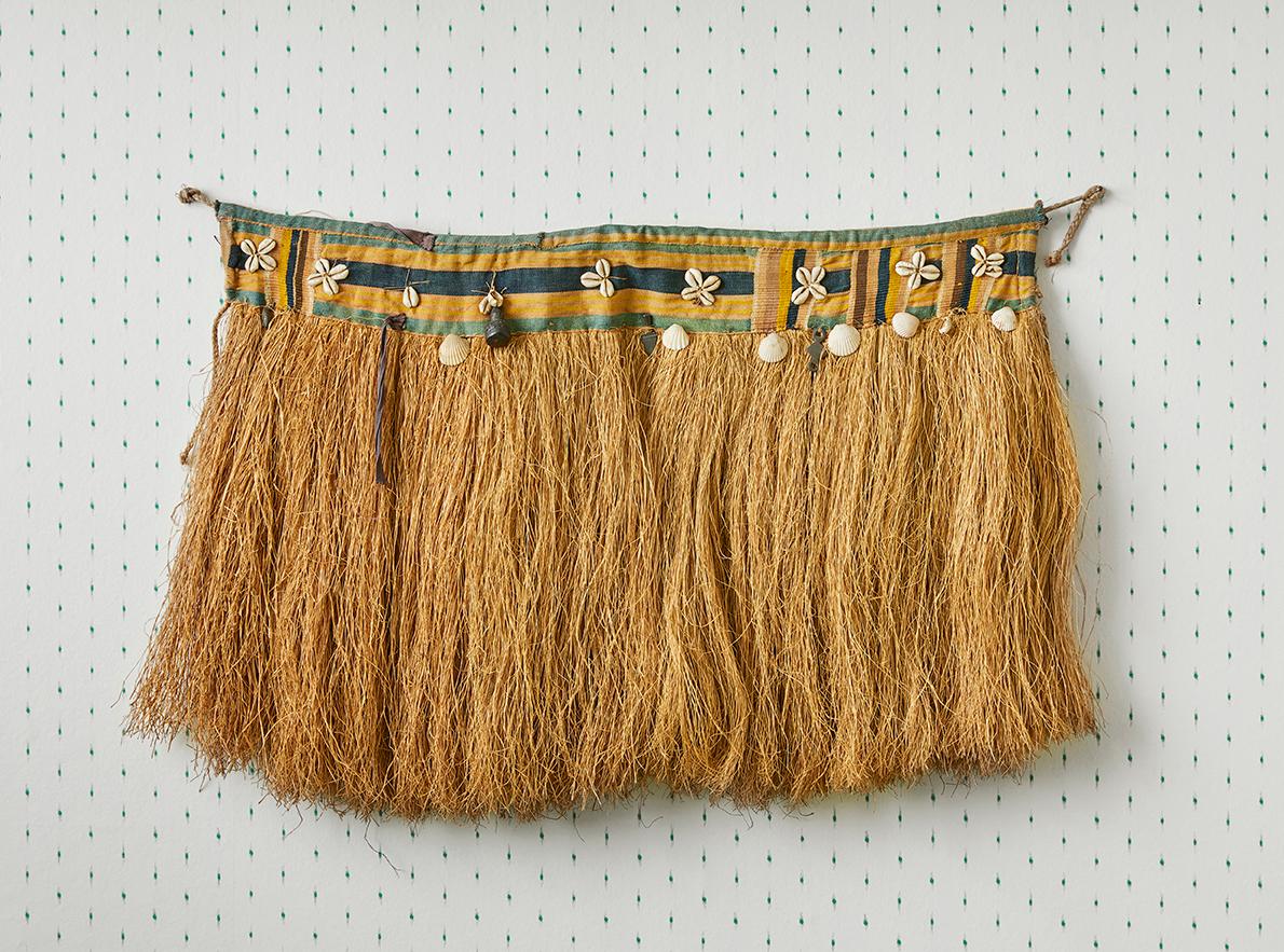 Ghana, Vintage

Ewe ceremonial dance skirt made of raffia, textile and decorated with shells.

H 45 x W 65 cm