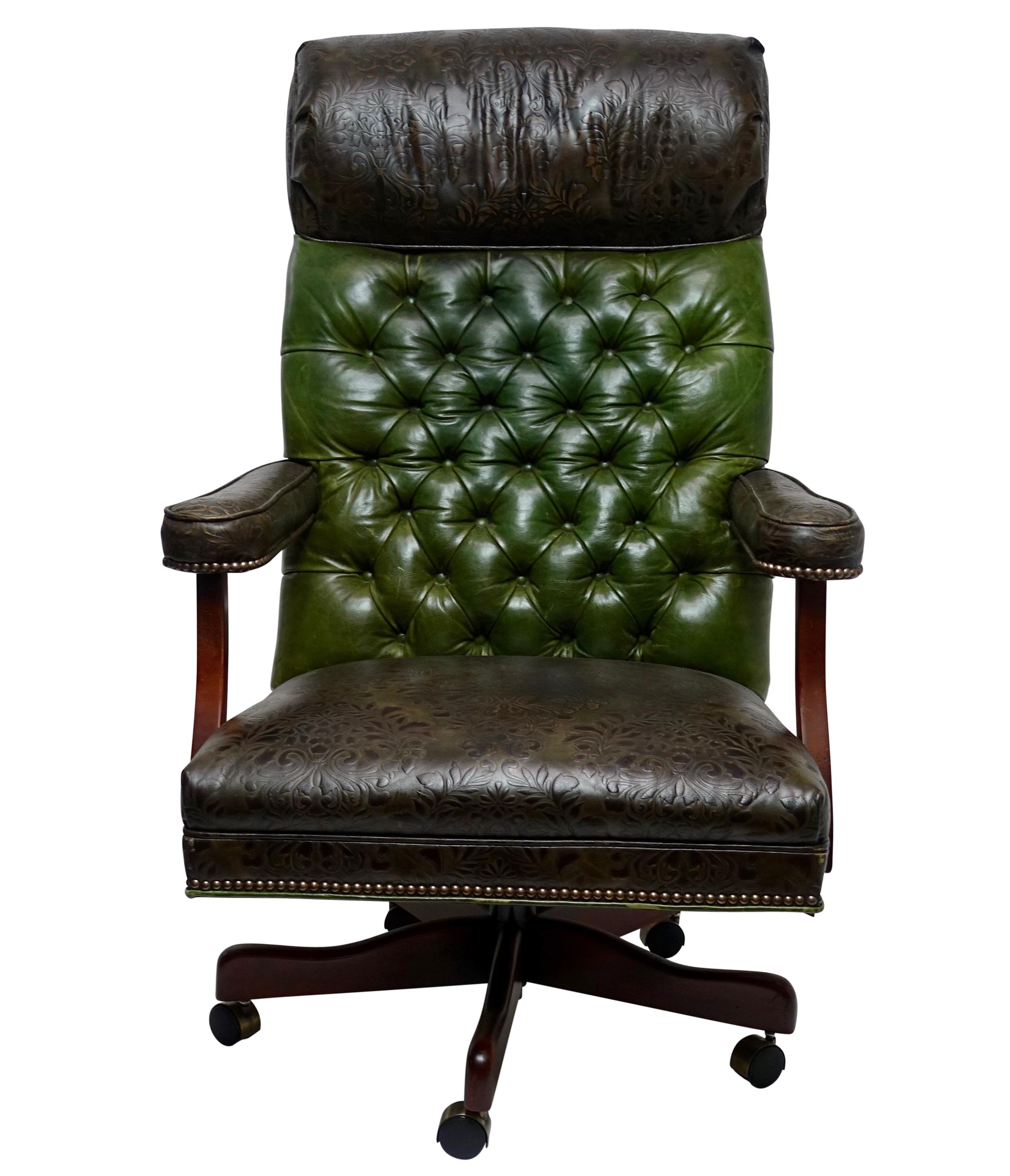 Custom mixed leather executive office chair with embossed brown leather headrest, seat, arms, with tufted green leather backrest. The chair is in remarkable condition the leather has been cleaned and conditioned. All the casters roll easily, the