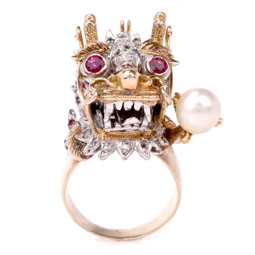 This whimsical vintage ring designed as a sculptured dragon head is crafted in a combination of 14 karat yellow gold with white gold accent, weighing 27.9 grams and measuring 30 mm wide by 16 mm high. The legendary dragon head is adorned with 0.25