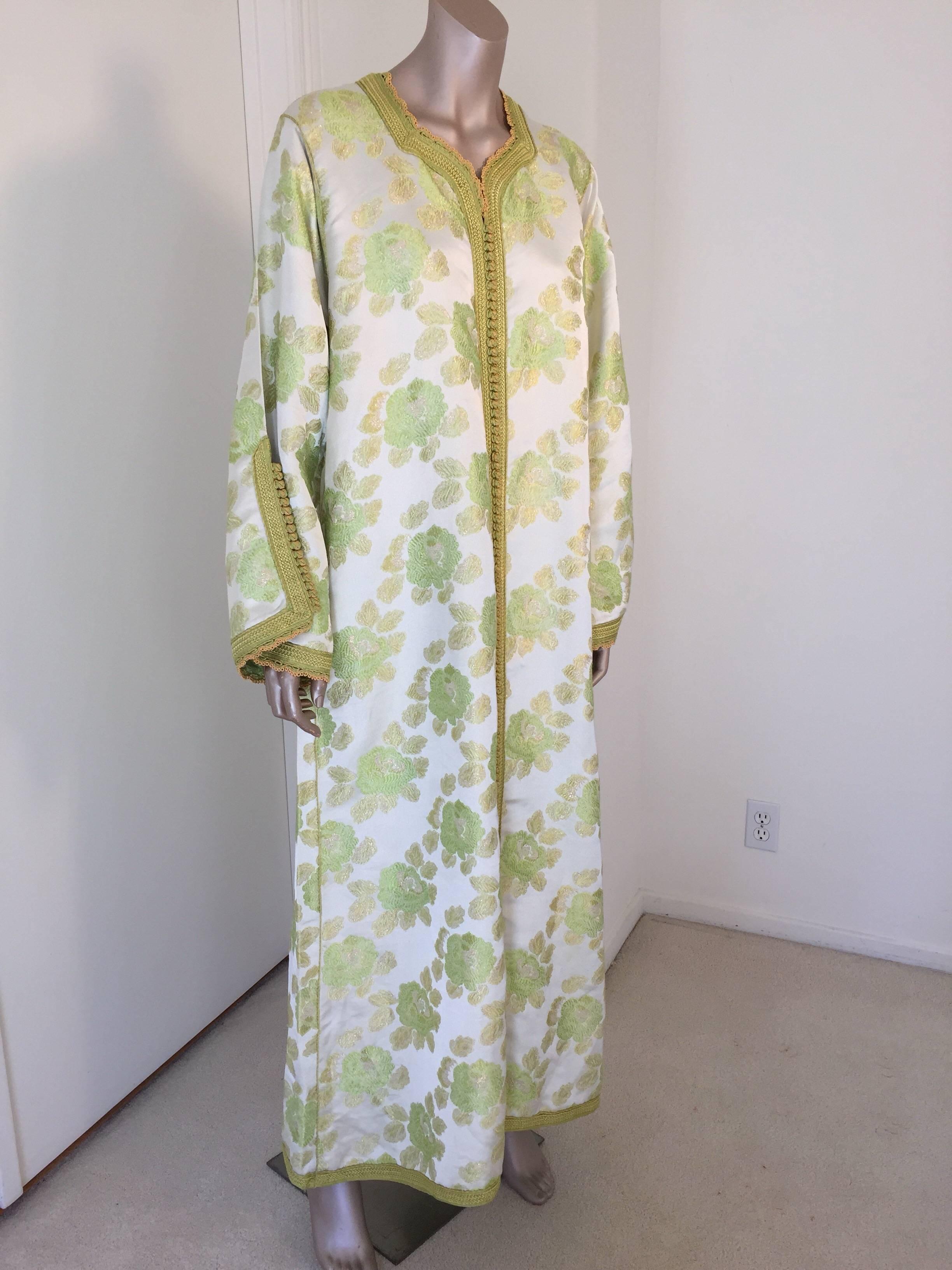 Moroccan caftan, evening or interior green and gold metallic floral brocade dress kaftan with gold and green trim.
Handmade vintage exotic 1970s metallic green brocade caftan gown, ceremonial Kaftan from North Africa, Morocco.
The luminous green