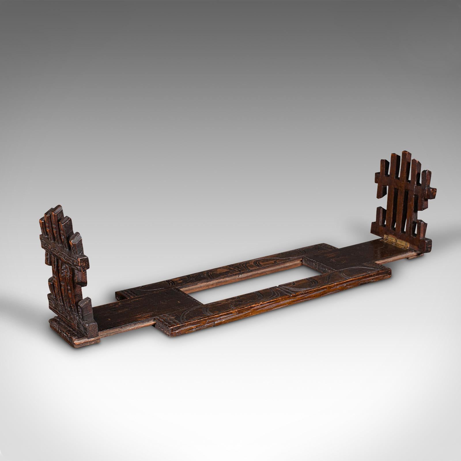
This is a vintage extending book slide. An Anglo-Indian, mahogany adjustable bookrest, dating to the late Art Deco period, circa 1940.

Fascinatingly distinctive book rest with unusual forms
Displays a desirable aged patina and in good original