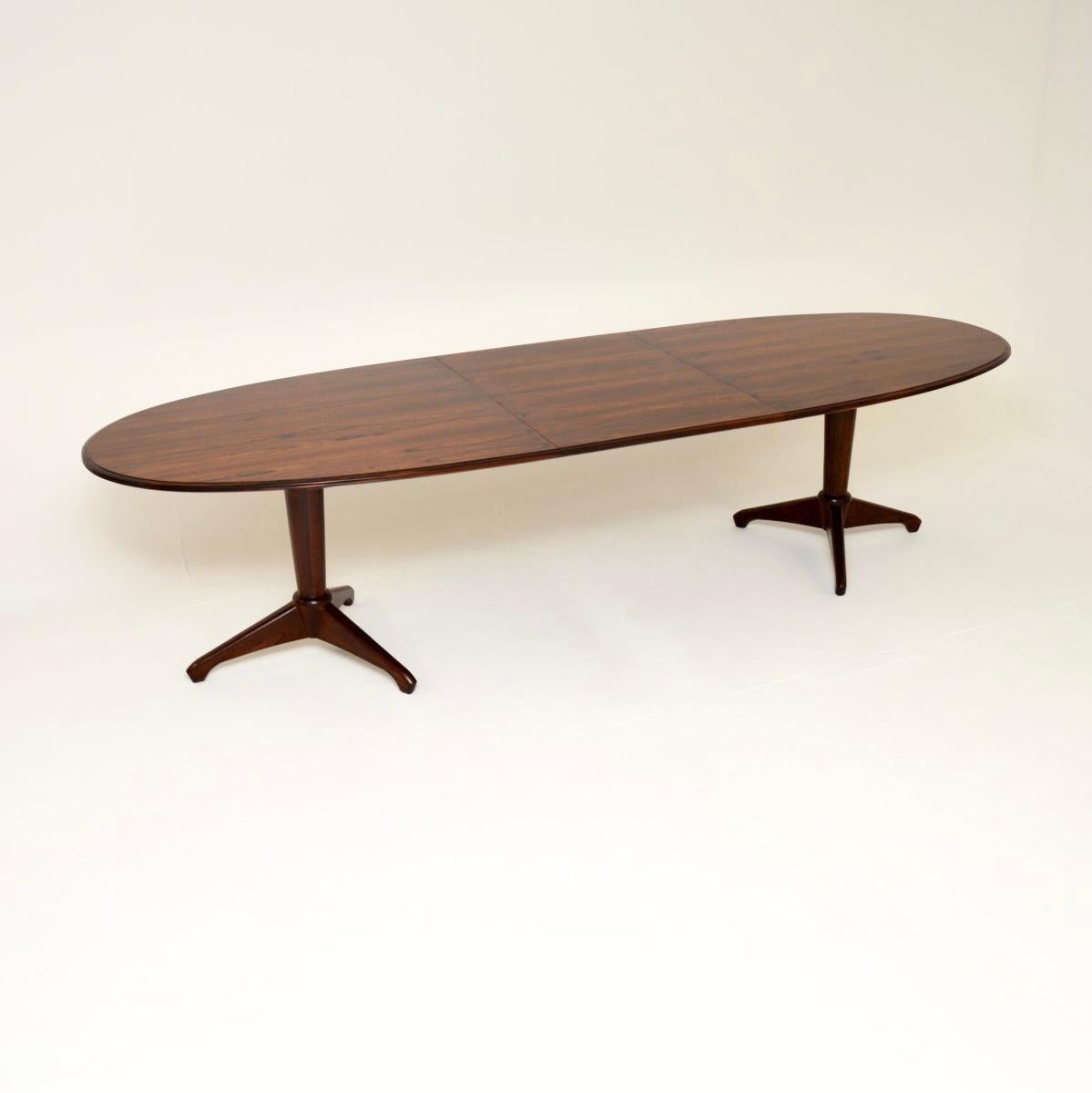 A stunning and very rare vintage extending dining table by Andrew Milne for Heal’s. This was made in England, it dates from the 1950’s.

This model was designed exclusively for Heal’s in the 1940’s, it is of absolutely superb quality. The large oval
