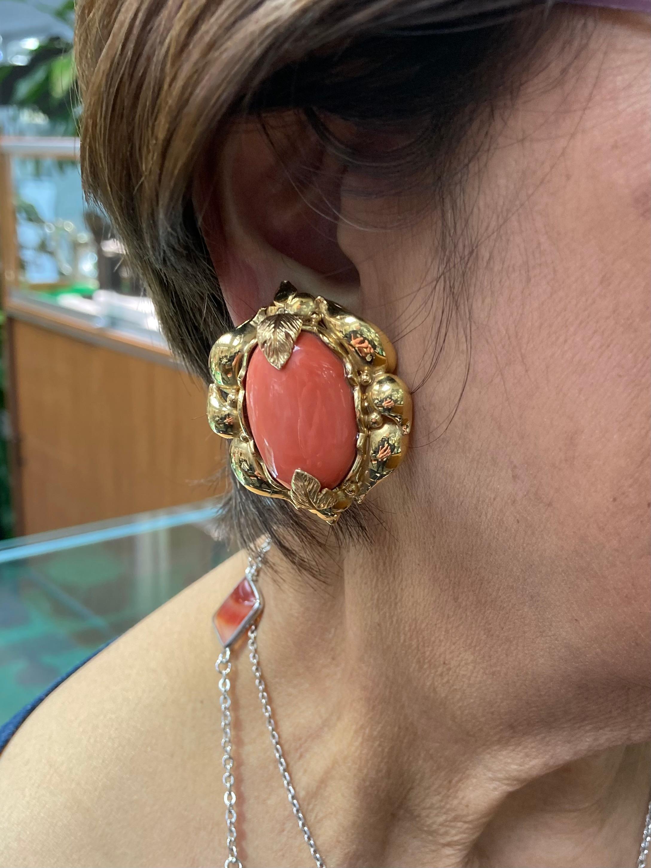 Vintage Extra Large natural coral and yellow gold clip-on earrings circa 1970s. *

 These Extra-large Natural Coral and Yellow Gold Clip-On Earrings from the 1970s epitomize the bold aesthetic characteristic of that era. This decade witnessed a