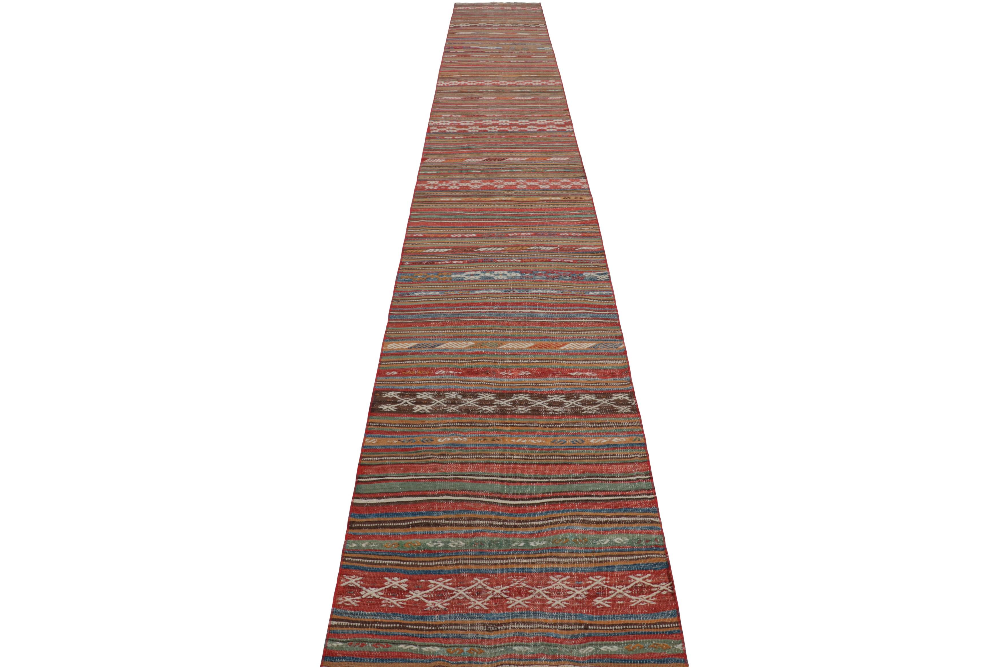 Hand-Woven Vintage Extra-Long Kilim Runner Rug with Stripes and Tribal Motifs  Rug & Kilim For Sale