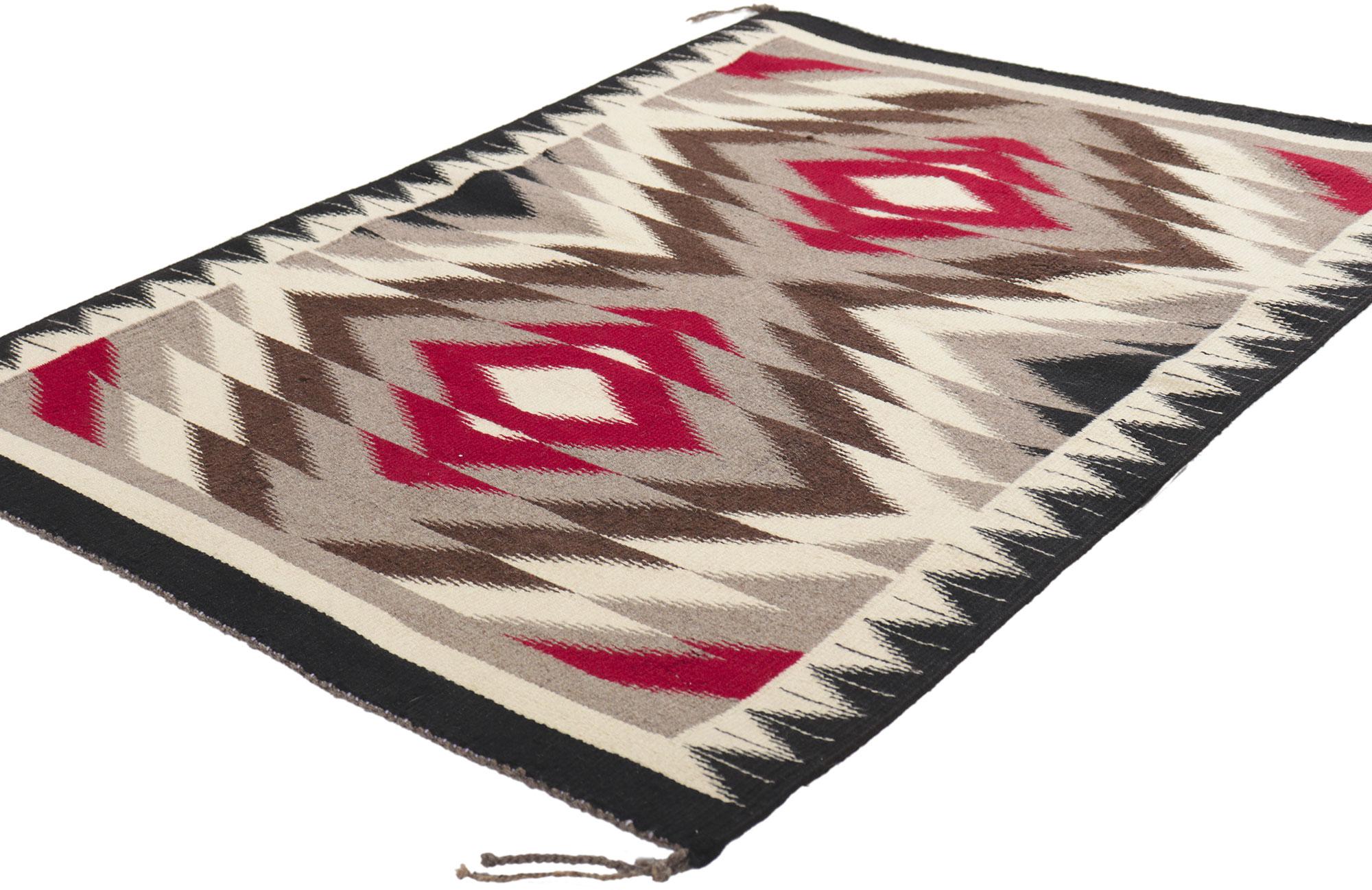 78424 Vintage Navajo Eye Dazzler Rug, 02'05 x 03'05. Full of tiny details and an expressive design, this handwoven wool vintage Navajo rug is a captivating vision of woven beauty. The abrashed field features a concentric lozenge. Rich in symbolism
