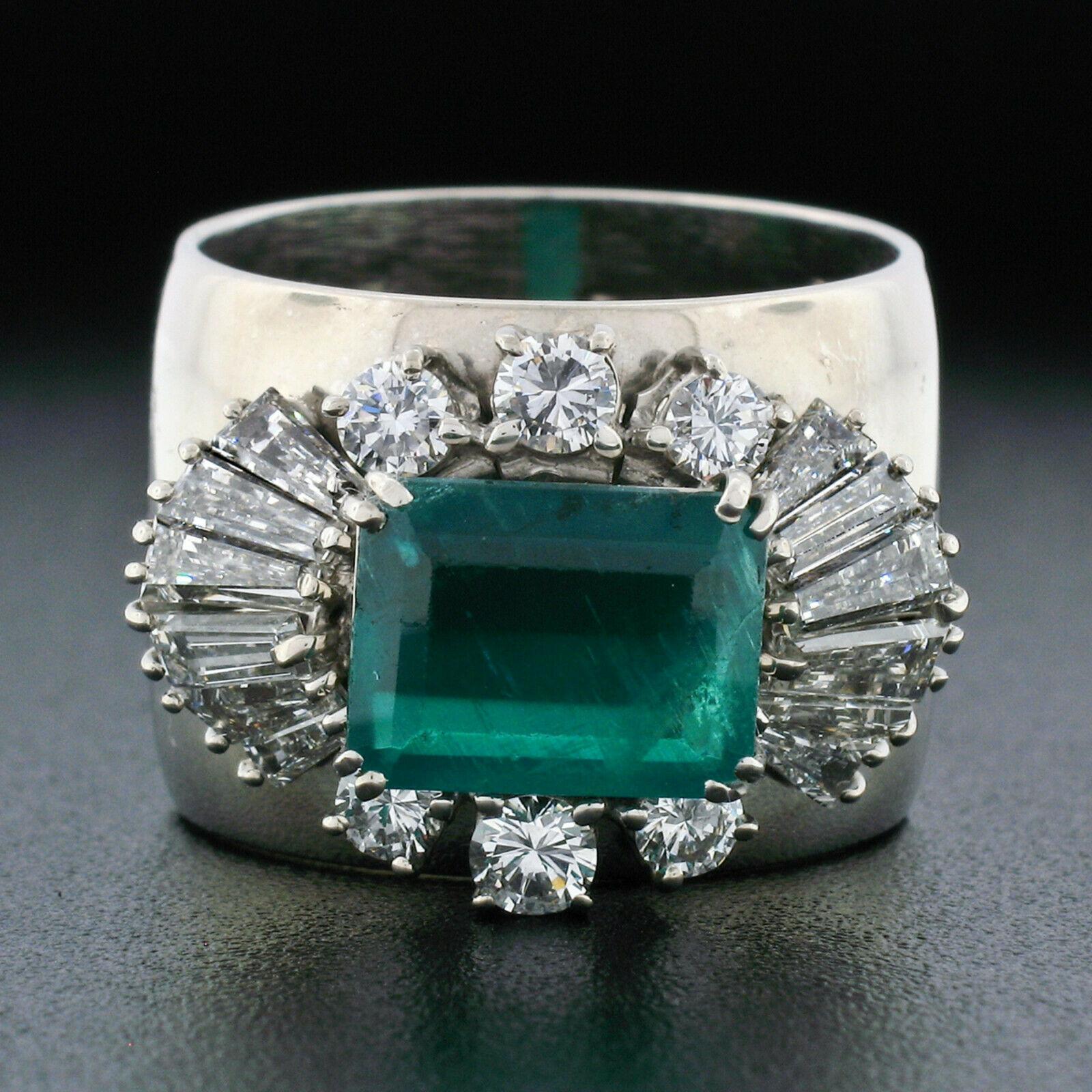This truly breathtaking, GIA certified, vintage emerald and diamond cocktail ring was crafted in Italy from solid 18k white gold by F. Moroni. The ring features an outstanding, natural, octagonal step cut emerald that displays a fine and deep green