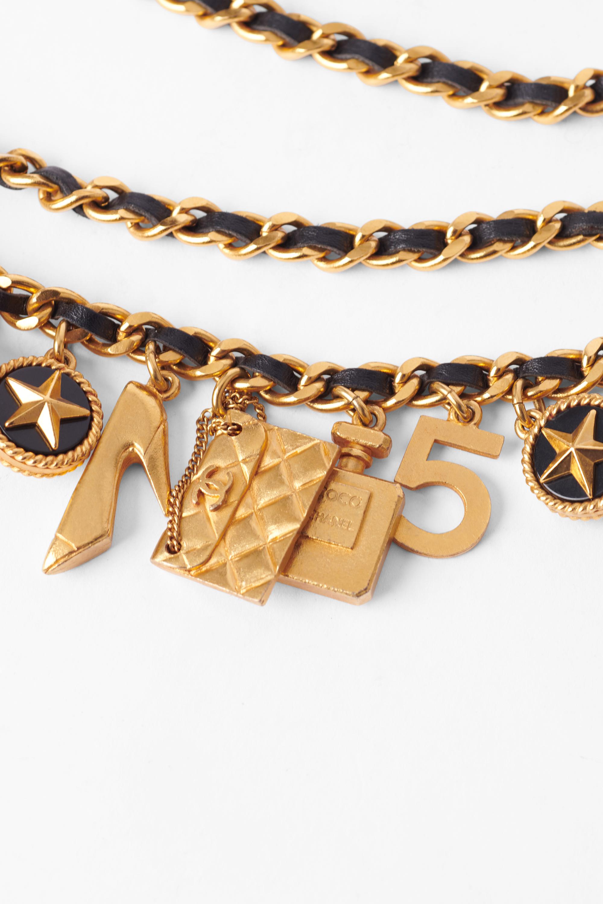 Vintage Chanel Fall Winter 1993/94 lucky charms belt. This line was considered the ‘Lucky Charms’ collection, with each charm holding personal significance to Coco Chanel like the handbag, shamrock, perfume bottle and lion’s head. She was known to