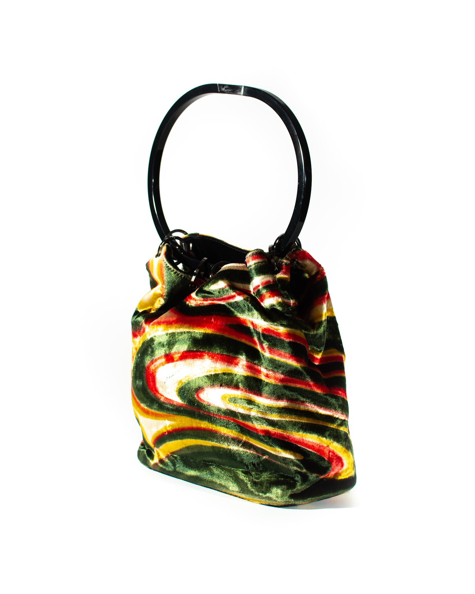 Presenting  From the Gucci F/W 1999 collection designed by Tom Ford, this gorgeous lucite hoop, bucket bag features Tom Ford's memorable psychedelic pattern in silk velvet. The same pattern is seen on the runway on other pieces in this collection.