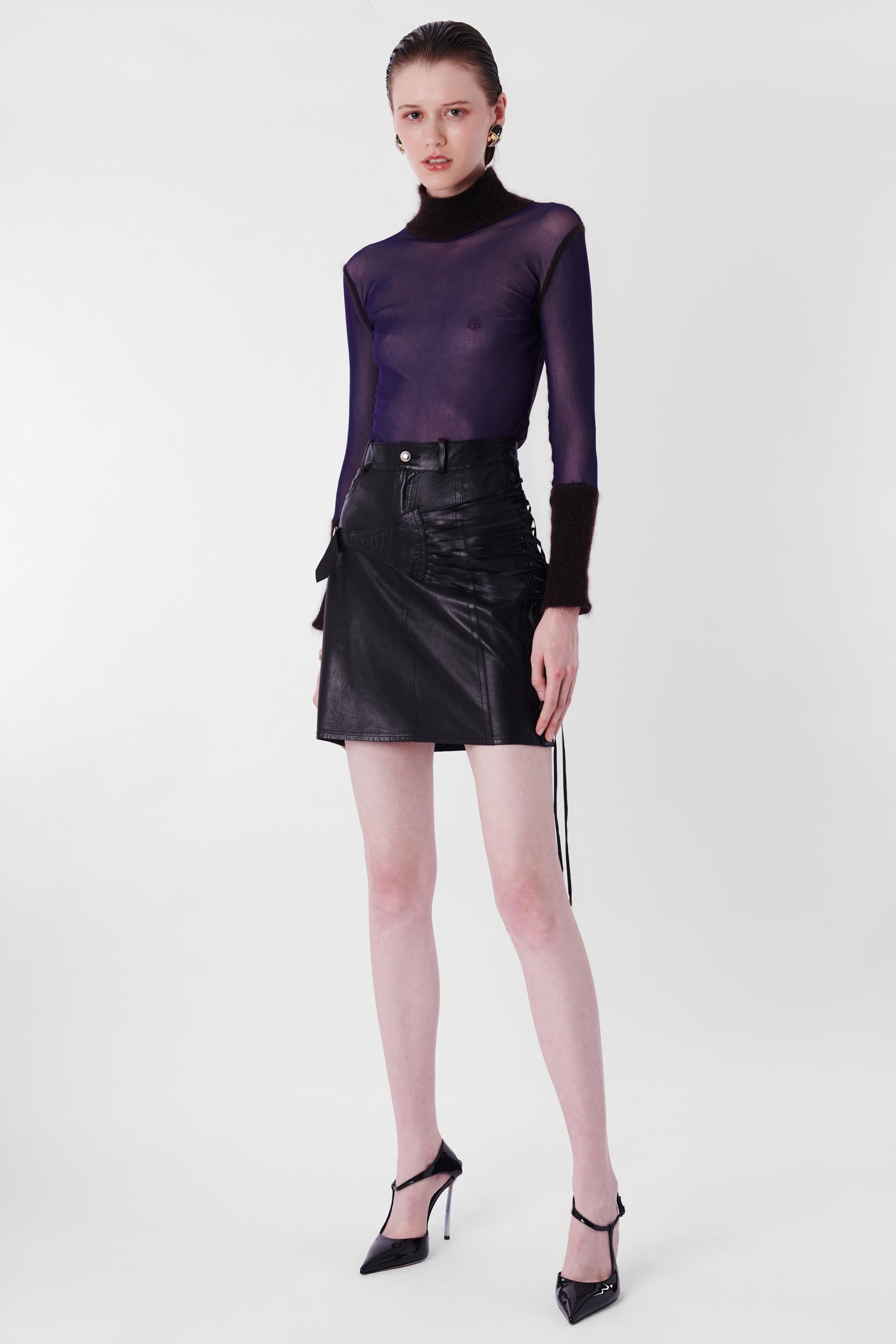 We are excited to present this incredible runway Christian Dior by John Galliano F/W 2003 Black Leather Bondage Mini Skirt. Features lace up side body and bondage detail on hips, zipper and button for closure in mini length. In excellent vintage