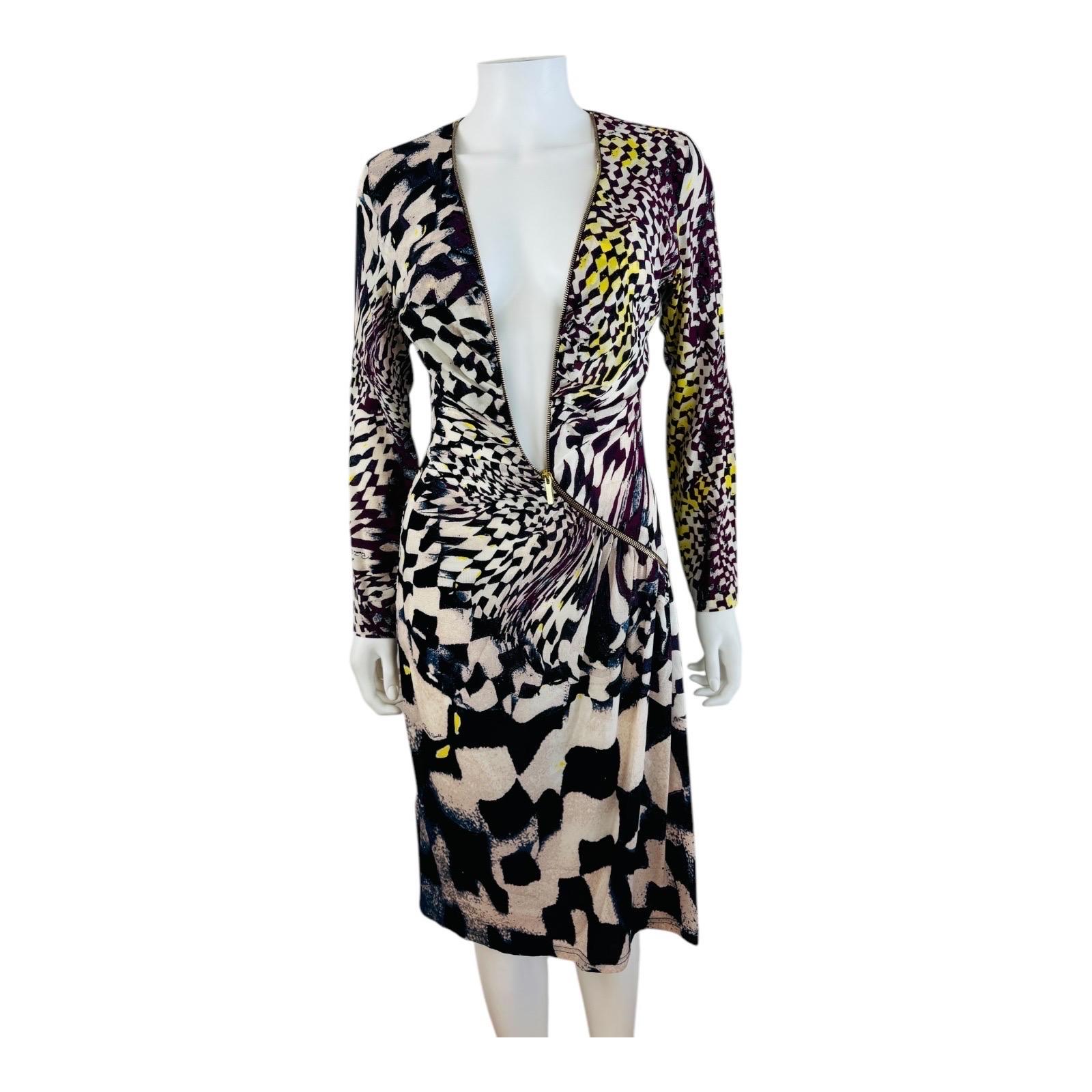 Vintage F/W 2003 Roberto Cavalli Silk Dress
Multi color abstract geometric print on stretch silk
Brass zipper details with logo detailing down the entire length of the dress can be zipped from the top and bottom of the dress
Long tapered