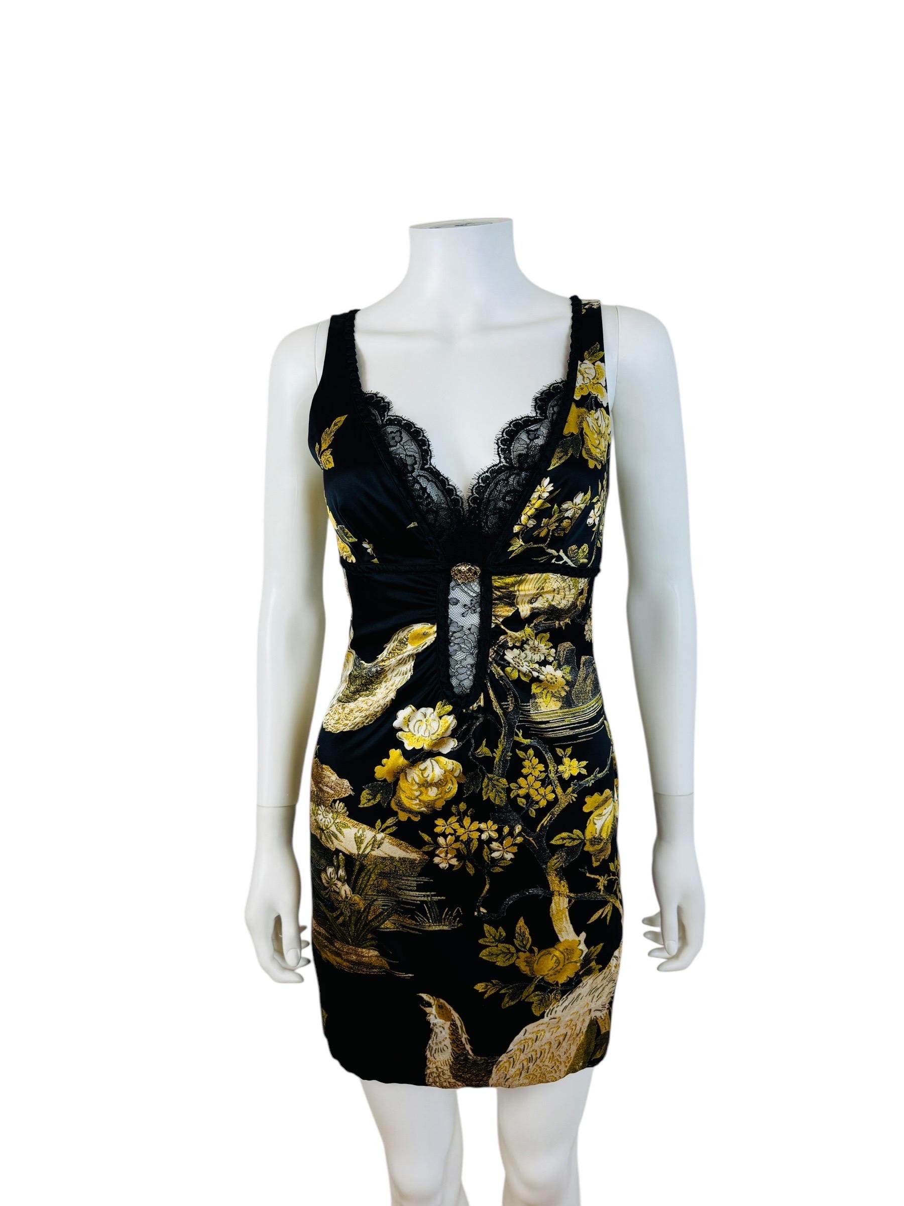 Stunning F/W 2006 Roberto Cavalli Dress
Black stretch silk fabric with oversized floral + pheasant print
Double layer of eyelash lace trim at the bust
Gold snake medallion with rhinestone at the bust
Hand painted style print
Sleeveless
Deep V