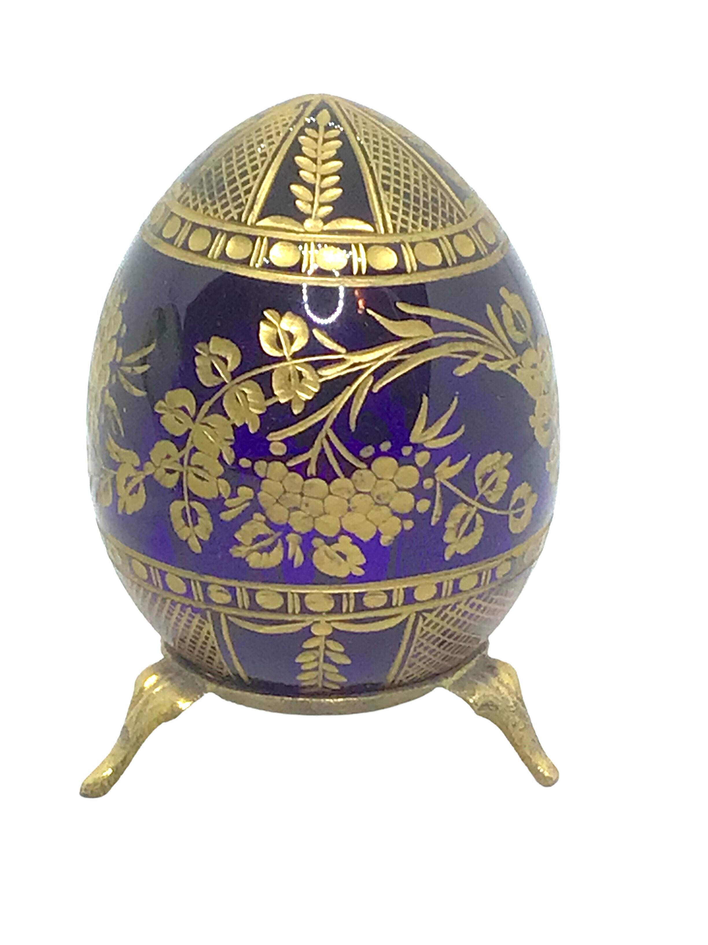 Vintage Faberge Russia style glass egg with etched decorations. Reminiscent of eggs from St. Petersburg. Measures: 2.13