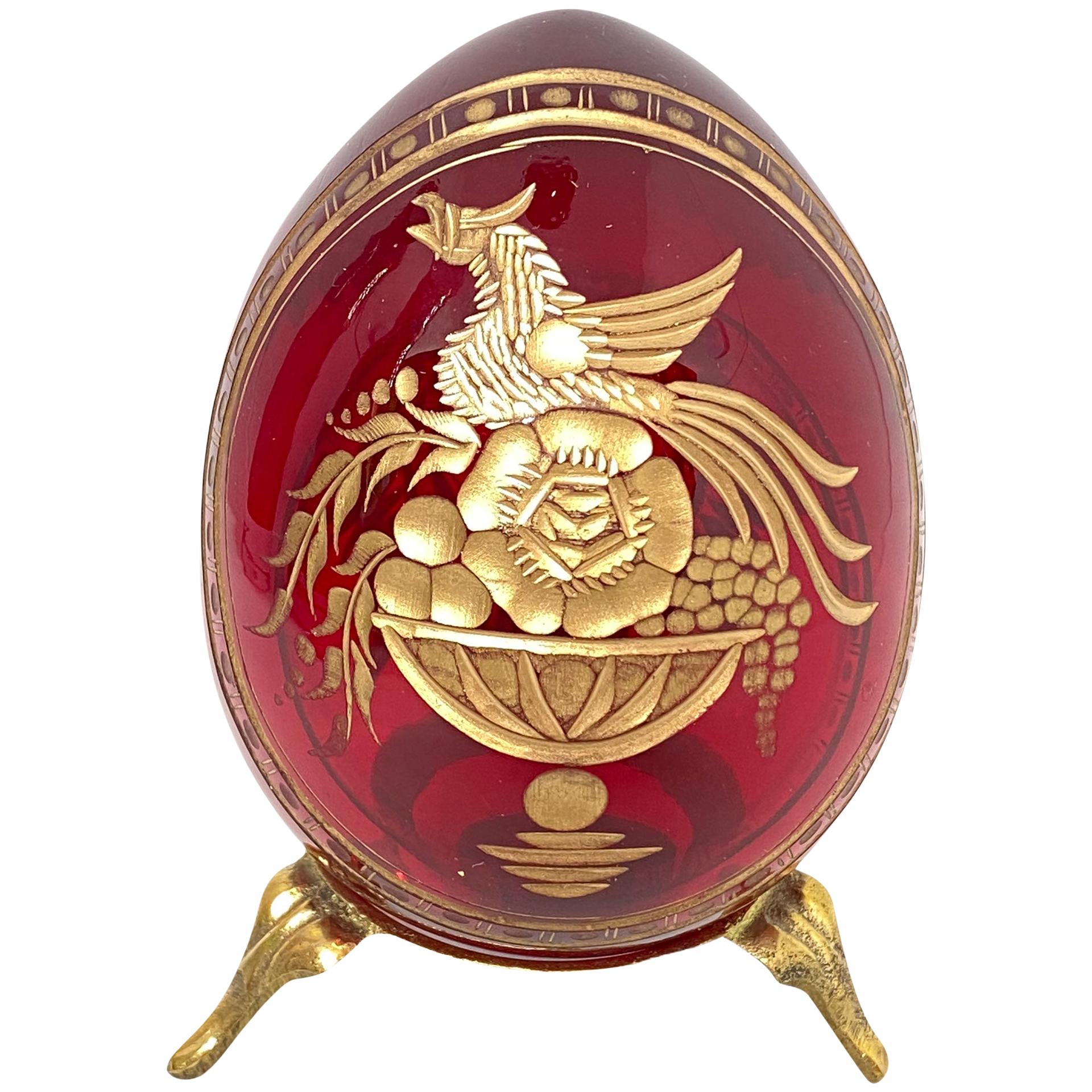 Vintage Faberge Russia style glass egg with etched royal garnishment. Reminiscent of eggs from St. Petersburg. Measures: 2.13
