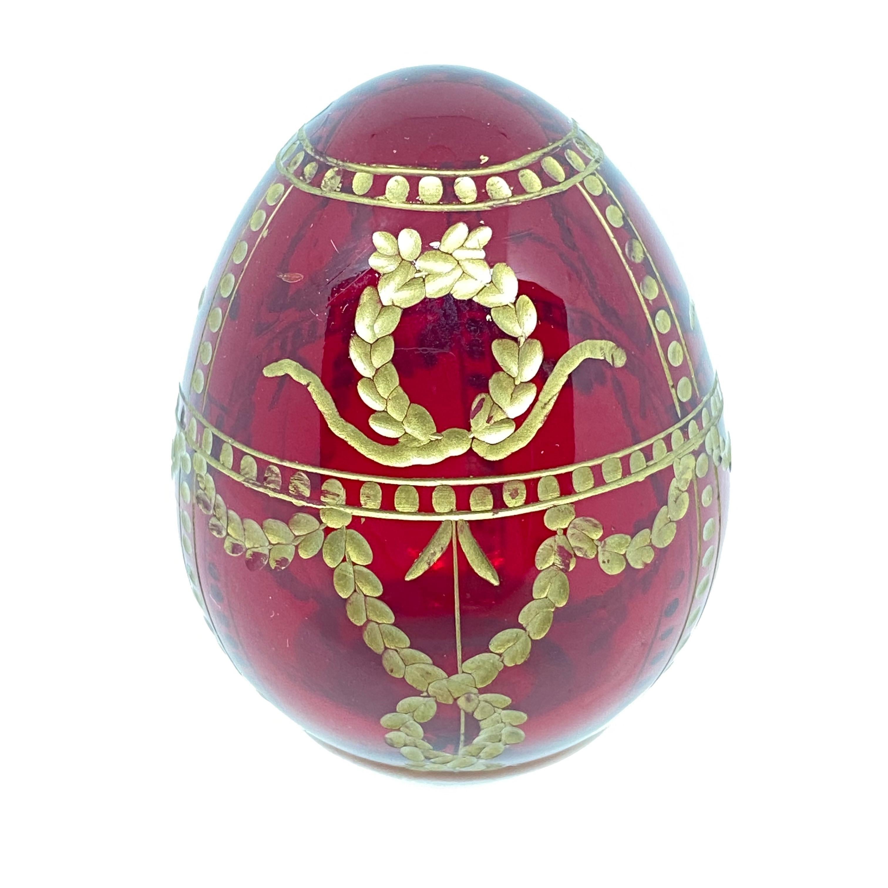 Vintage Faberge Russia style glass egg with etched royal garnishment. Reminiscent of eggs from St. Petersburg. Measures: 1.63