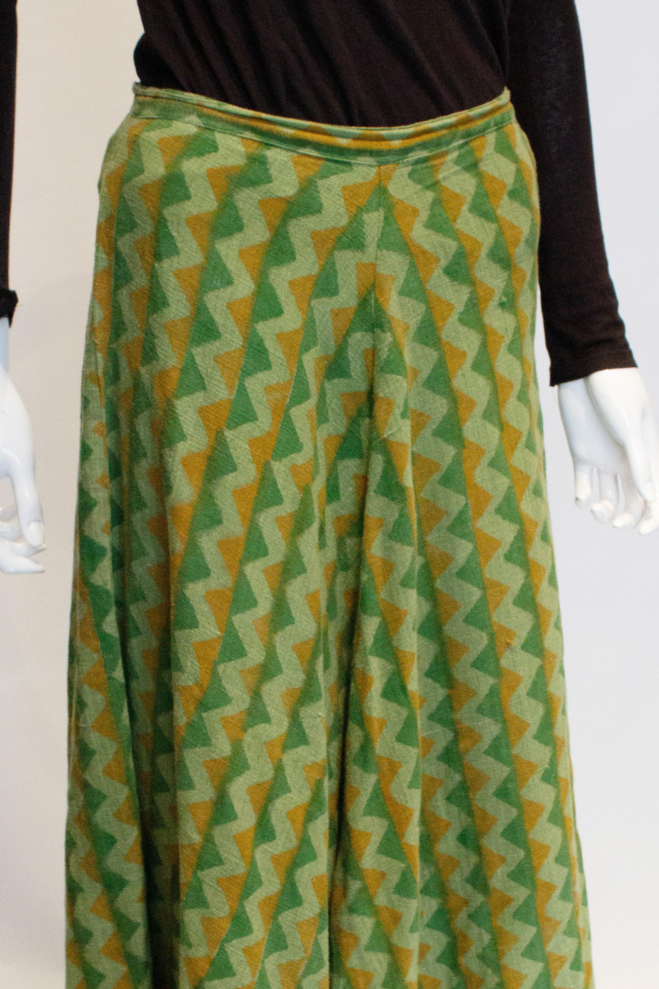 A great vintage skirt for Fall.  The skirt is in a heavy cotton in shades of green and brown with a side button opening. 
Measurements:  waist 29'' ,length 40''