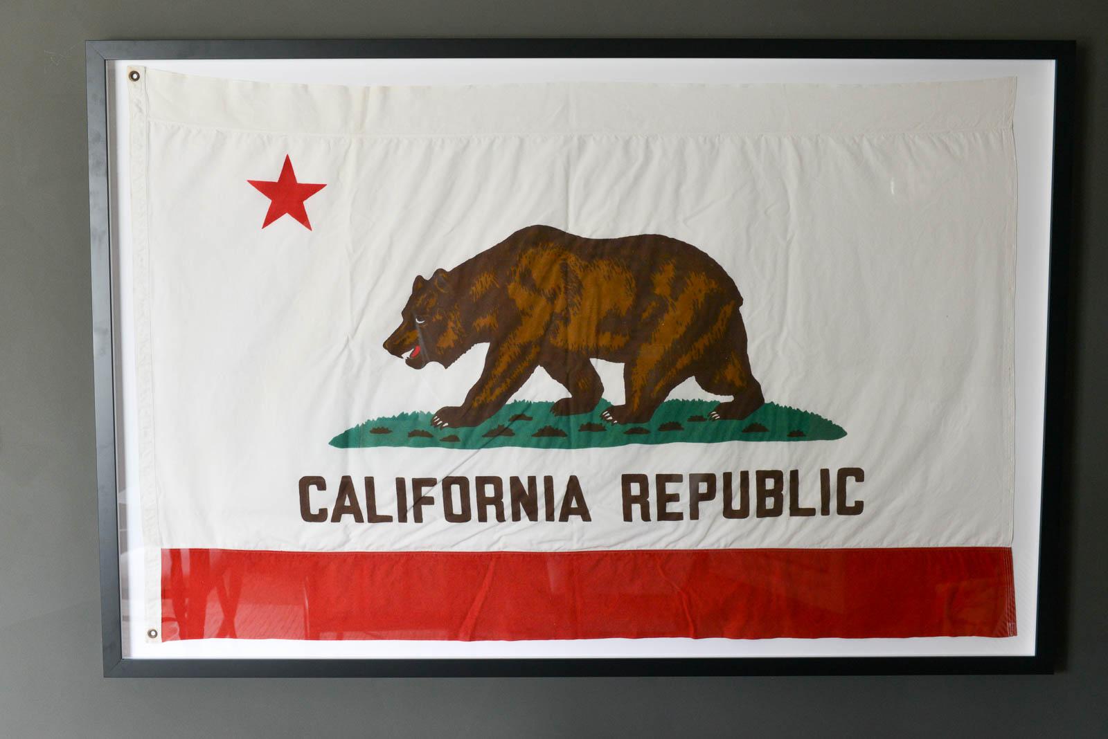 Vintage Fabric California State Bear flag. Professionally framed with acrylic plexiglass and thick wood frame. Flag is circa 1970 in excellent original condition. The flag is very large, framed this piece measures 78