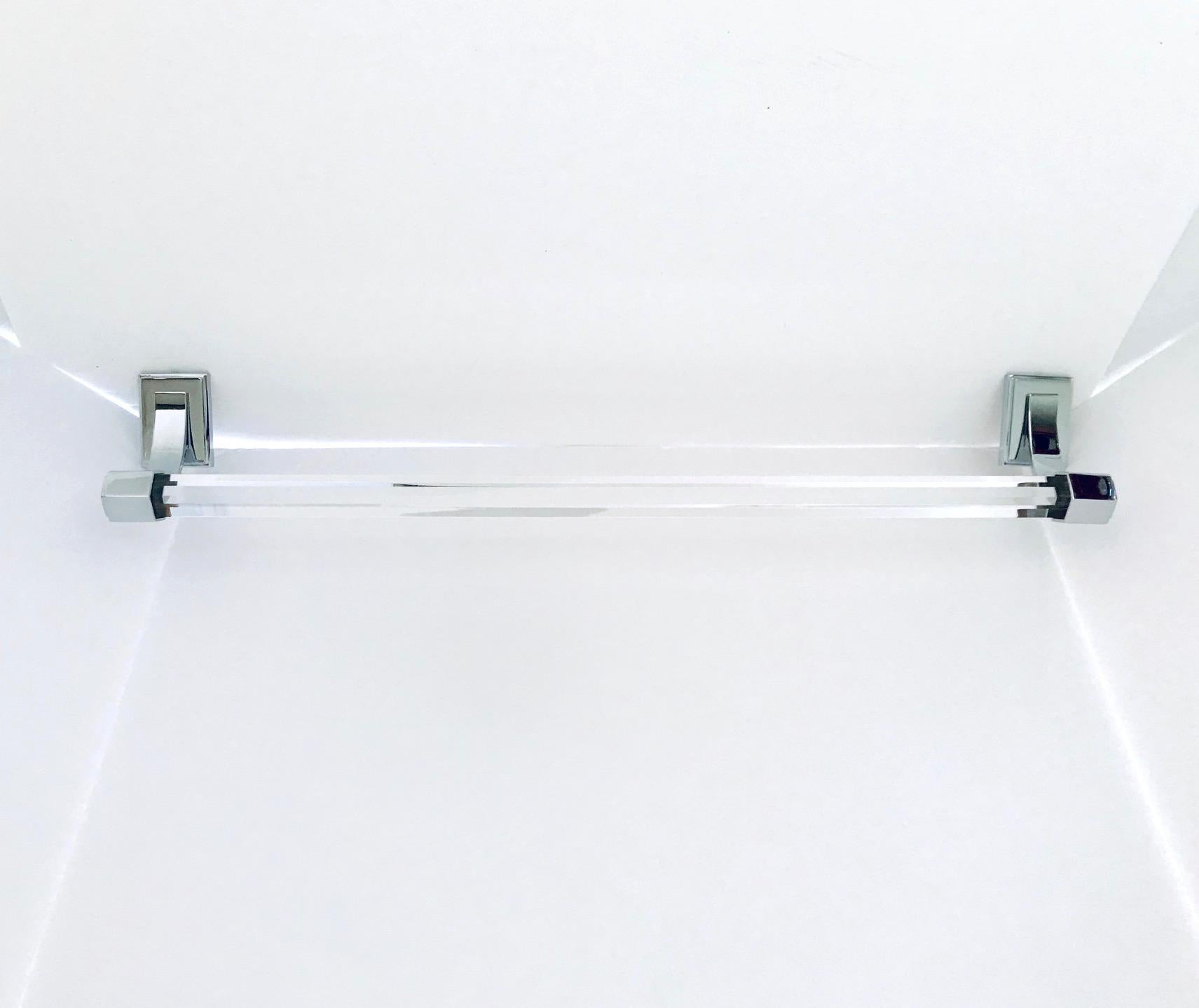 Modernist vintage bathroom or powder room towel bar, featuring a faceted glass bar with hexagon design and polished nickel fittings. Wall mount design with rectangular backplates and curved sides with hexagon fittings.