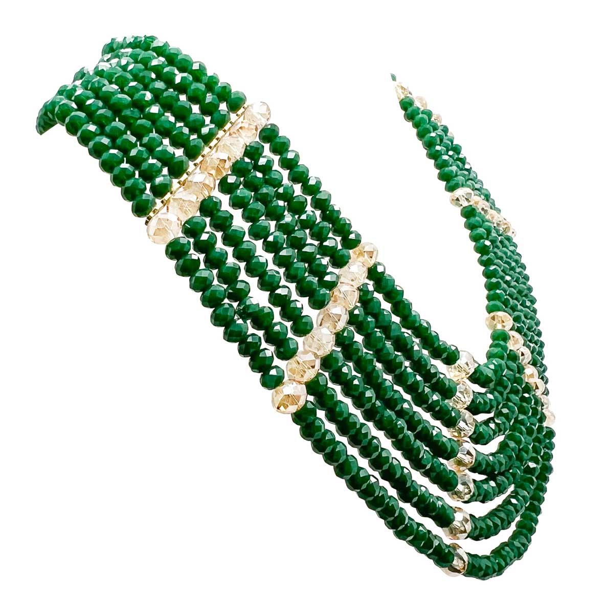 A stunning Vintage Faceted Crystal Bib from the 1960s. Seven luxurious rows of faceted beads in a deep green agate colour are accented to perfection with glistening champagne crystals. An incredible work of wearable art that carries style and