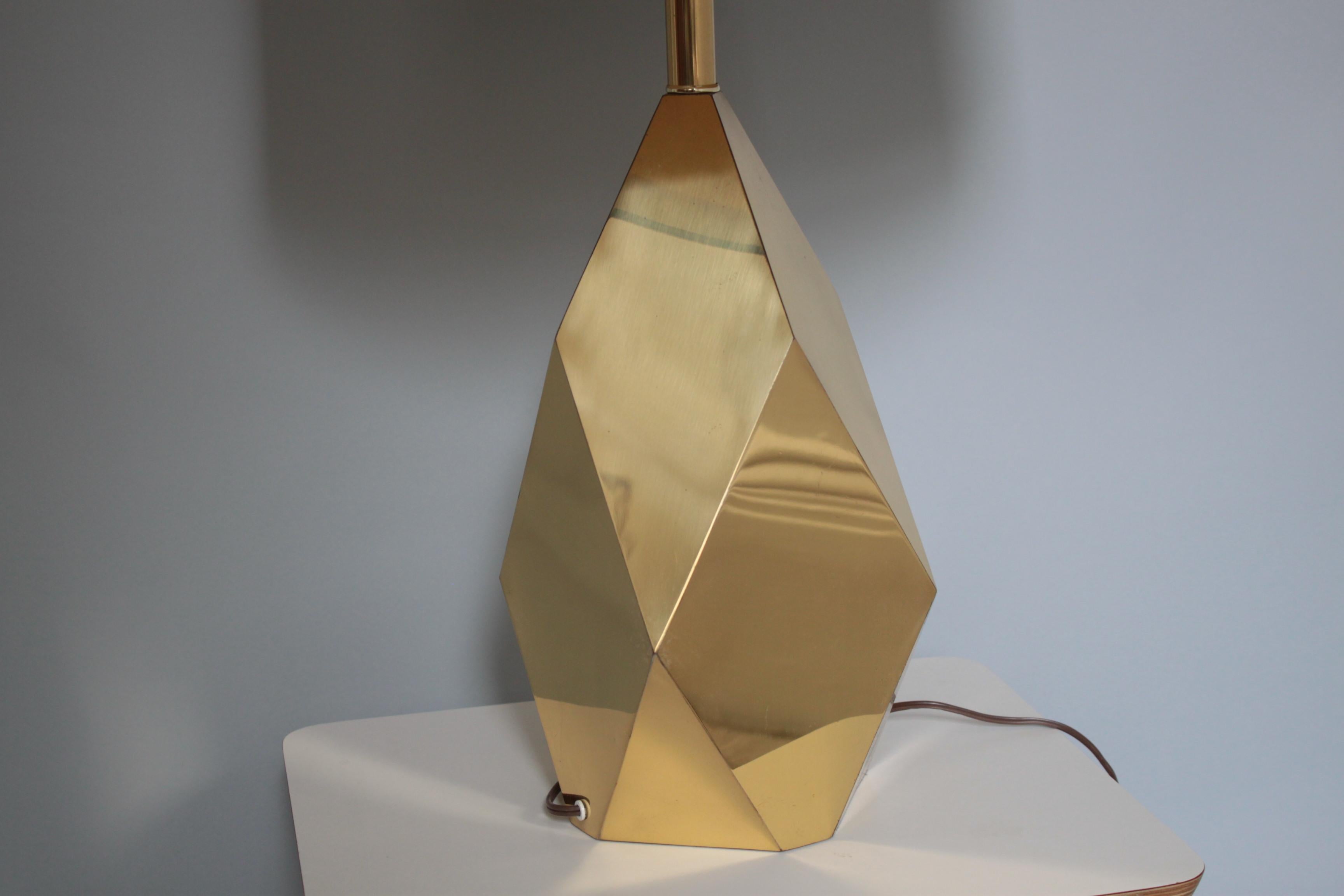 1970's Mid-century faceted table lamp. 

Illuminate your flat with this beautifully modern mid-century style faceted table lamp with a brass polished finished metal. Light bounces off of each facet creating a wonderful three dimensional shape.