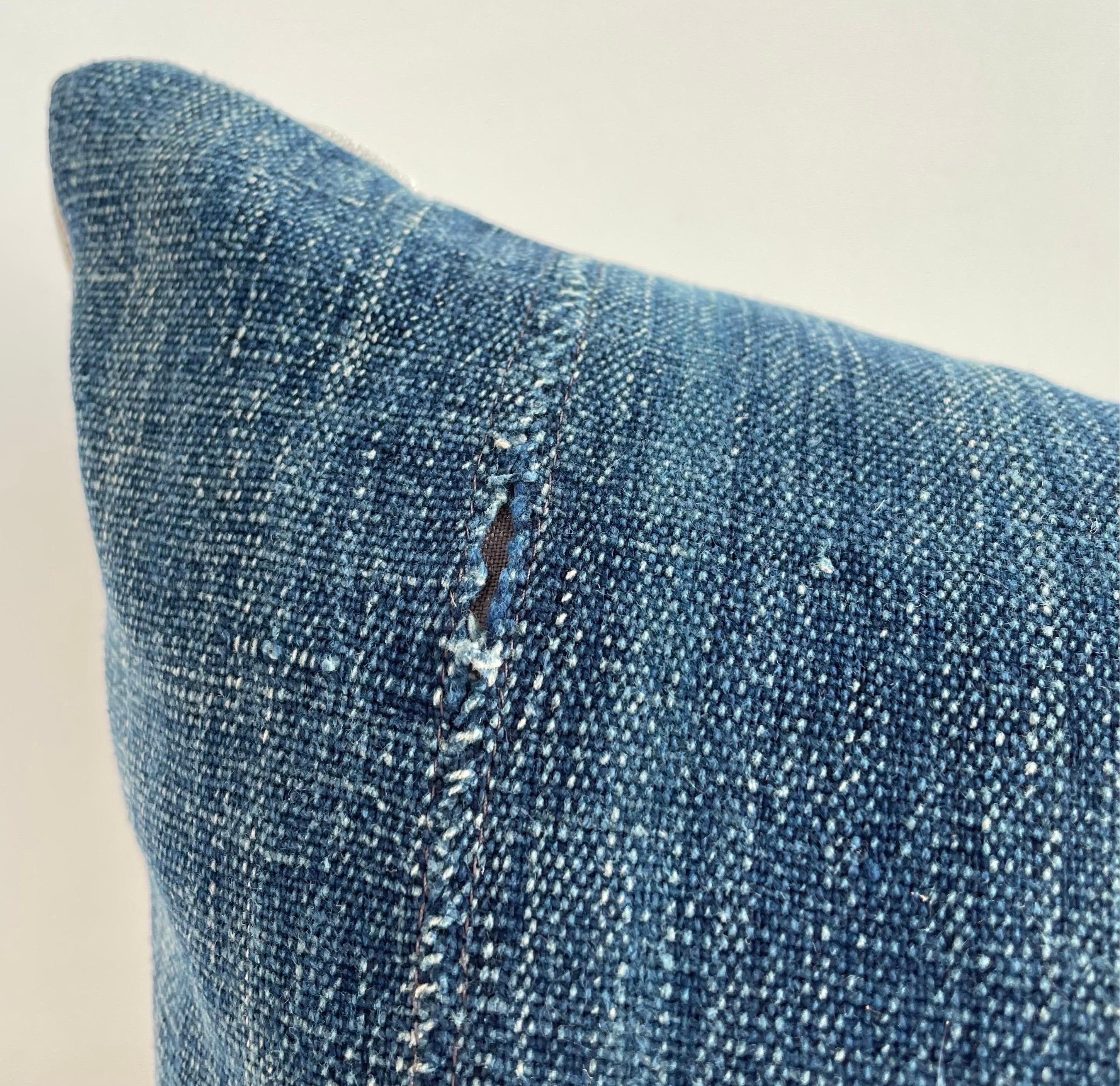 Antique faded blue indigo stripe African mudcloth pillows with original fringe details. Fabric: Vintage hemp fabric front, natural colored linen fabric back. Due to the nature of vintage textiles, there may be fading or markings. While they add to