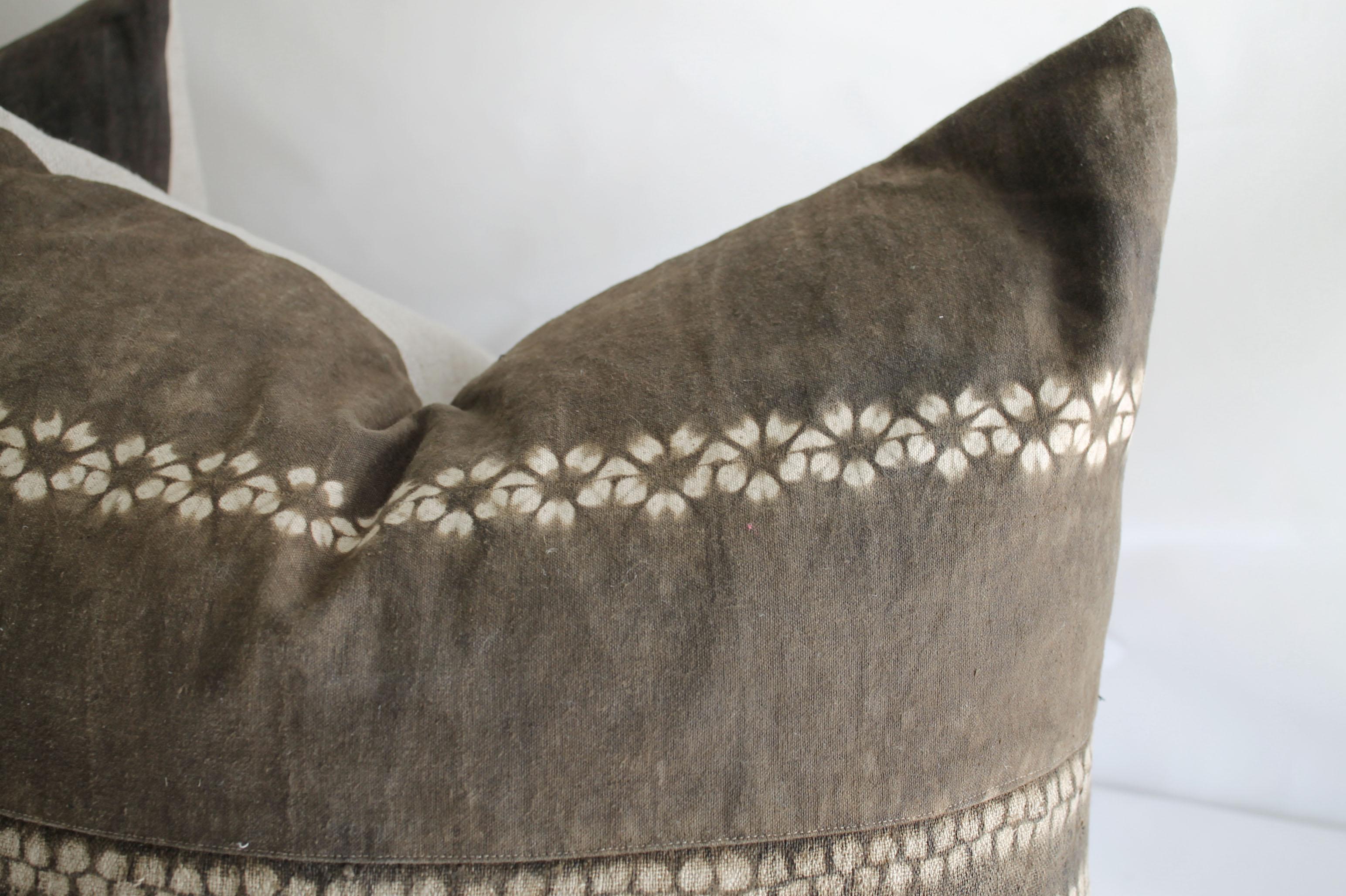 Vintage bleached batik textile lumbar pillow beautiful faded brown batik with light natural linen colored pattern dots horizontally across the face. The backside is a natural Belgian linen, with hidden zipper closure. No insert is