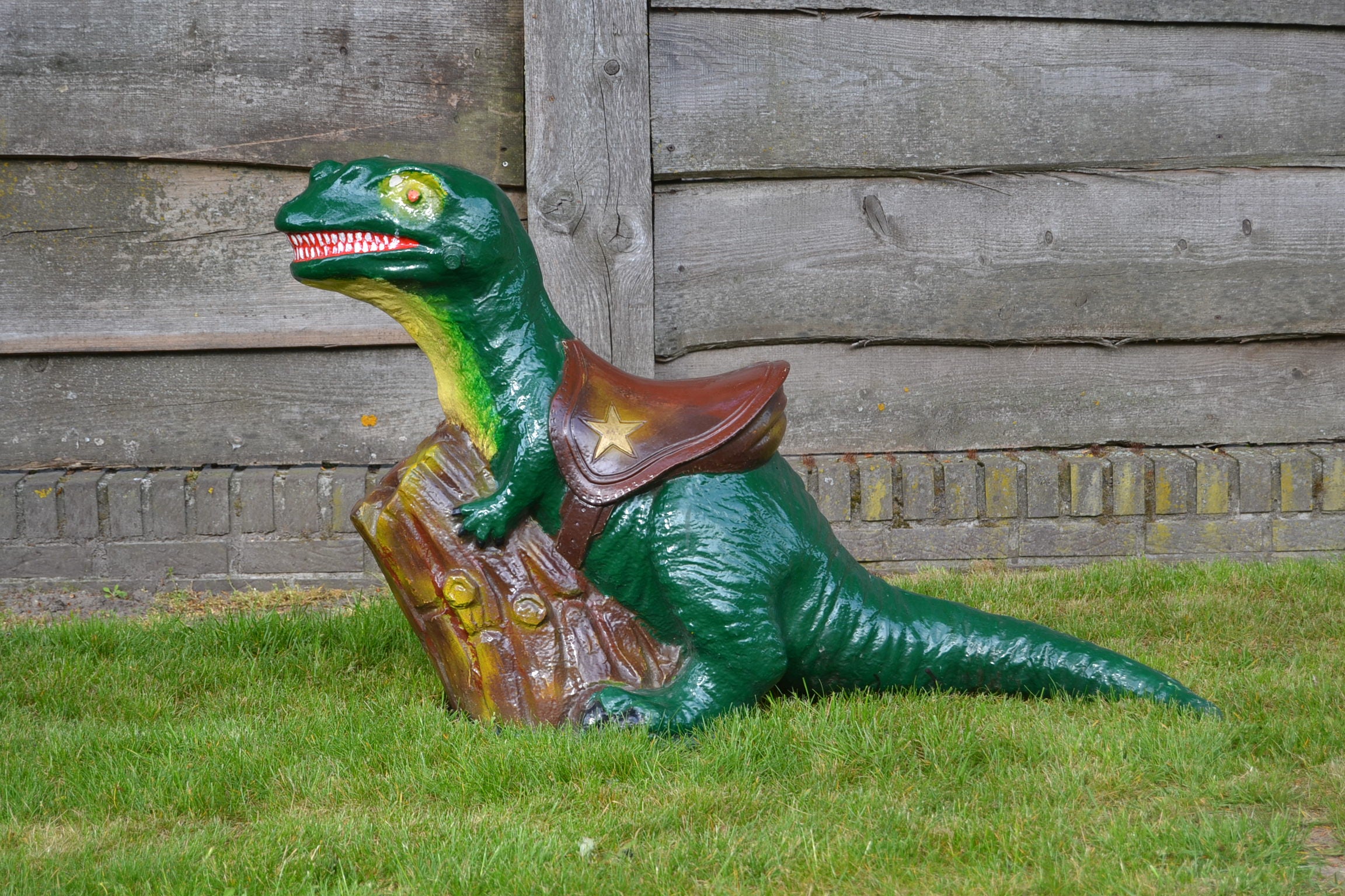 Dinosaur figurine or statue. 
A cute looking vintage Fairground - Funfair - Theme Park Dinosaur Statue. 
Dates circa 1980s - 1990s and is made from polyester. 

This childrens carnival seat is in good but used condition, so with some traces.
