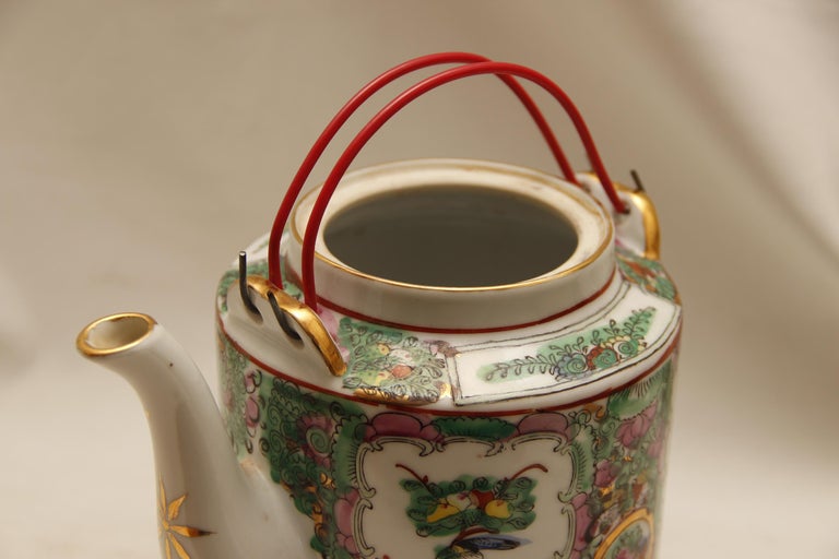 The bright colors and sharp patterns of famille rose medallion make this teapot a must-have. The teacup is a vintage Chinese export piece and it is in very good condition. The teapot also has its original lid. The colors of the peonies and leaves