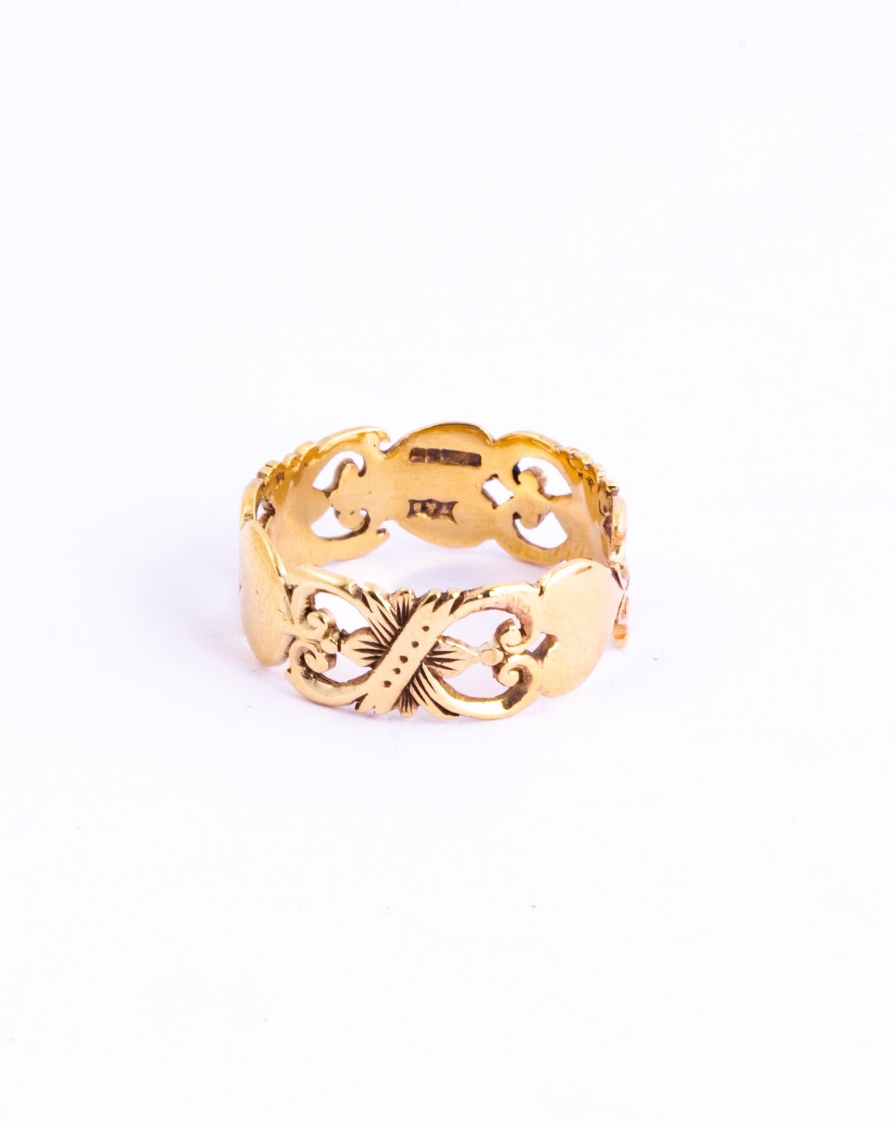 This gorgeous 9ct gold band features open work detail with hearts and scrolls. Made in Birmingham, England. 

Ring Size: N or 6 3/4
Band Width: 7mm

Weight: 2.6g