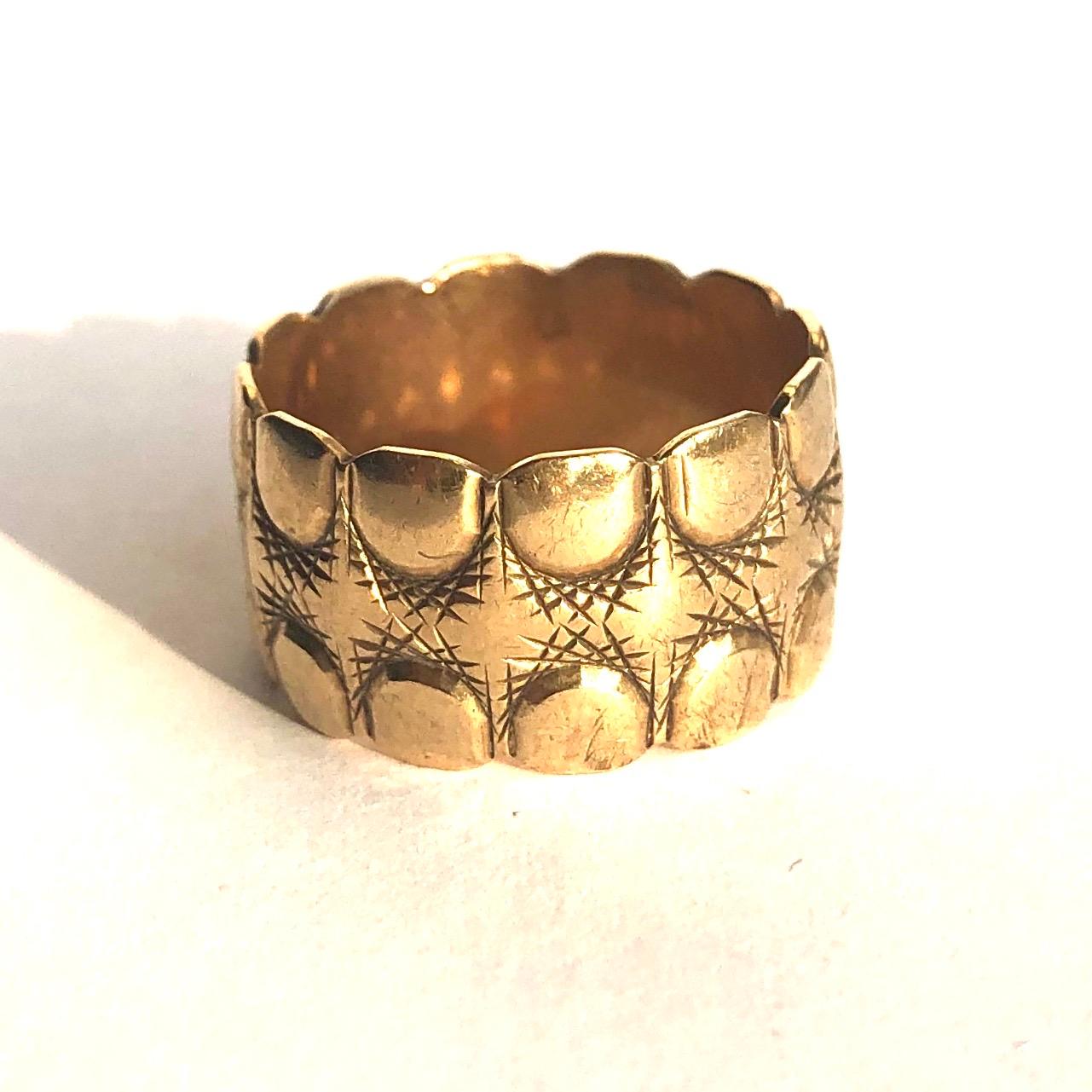 This decorative wide band has bags of texture and detail. It almost reminds my of an elephants toes! The ring was made in London, England. 

Ring Size: N or 6 3/4 
Band Width: 11mm

Weight: 5.62g