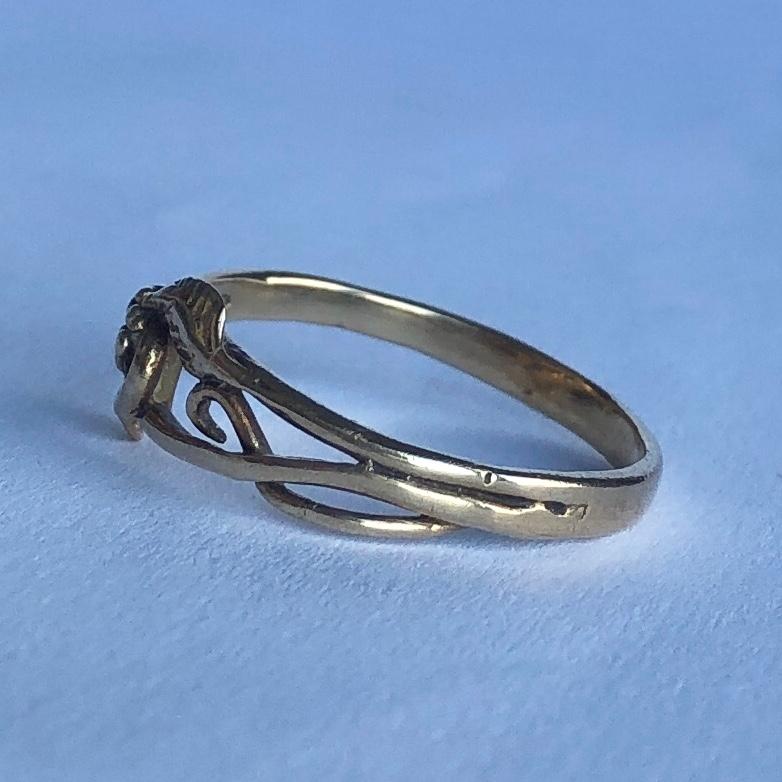 This fancy gold band has berry and vine detail that is wrapped around just the top of the band. This would made the most perfect wedding band or a fancy everyday ring!

Ring Size: M 1/2 or 6 1/2
Band Width: 8mm

Weight: 1.4g