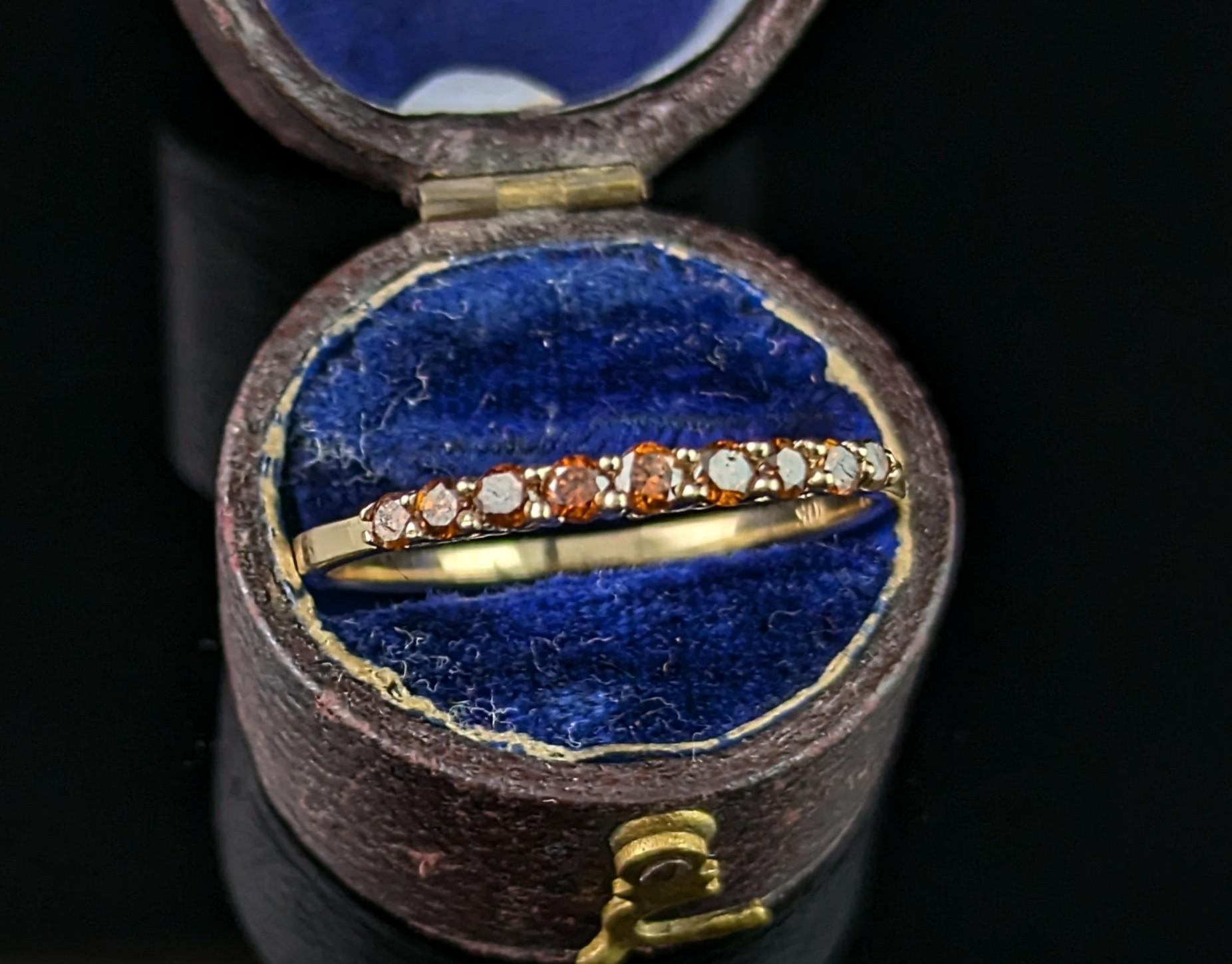 A gorgeous vintage fancy brown Diamond half eternity ring.

Stacked full of sparkling rich cognac diamonds, channel set into the front half of the ring, all open backed letting the light glisten through.

It has a slender and smooth 10ct yellow gold