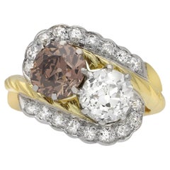 Vintage fancy coloured diamond crossover ring, circa 1950.