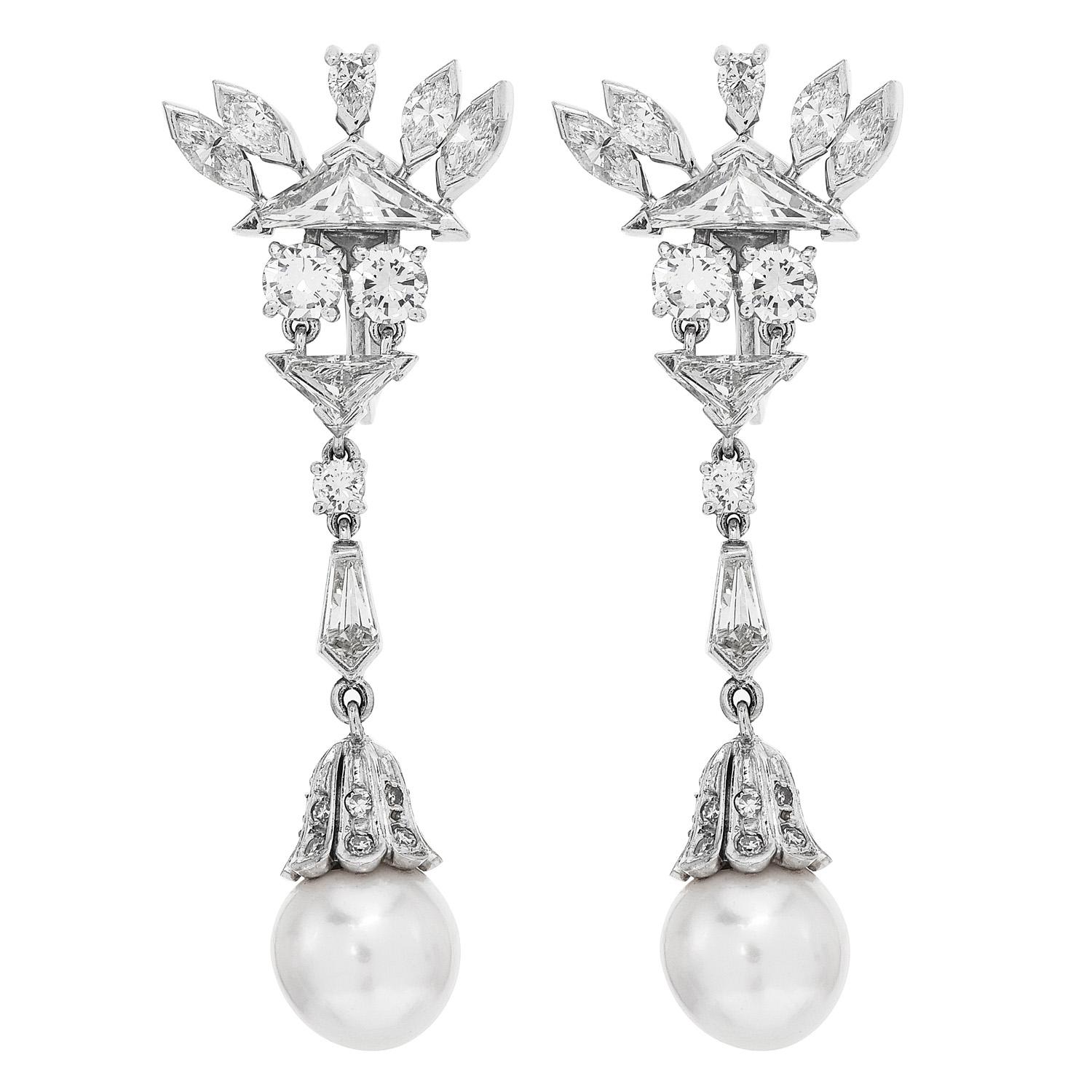 Indulge in the uniqueness of these vintage Akoya Pearl and

Diamond Earrings with Omega Backings! 

With (2) 9.5 mm Akoya Pearl centers, high Luster & Cream undertones,  complemented by the Mixed Cut, Diamonds,

The Geometric & Floral is a