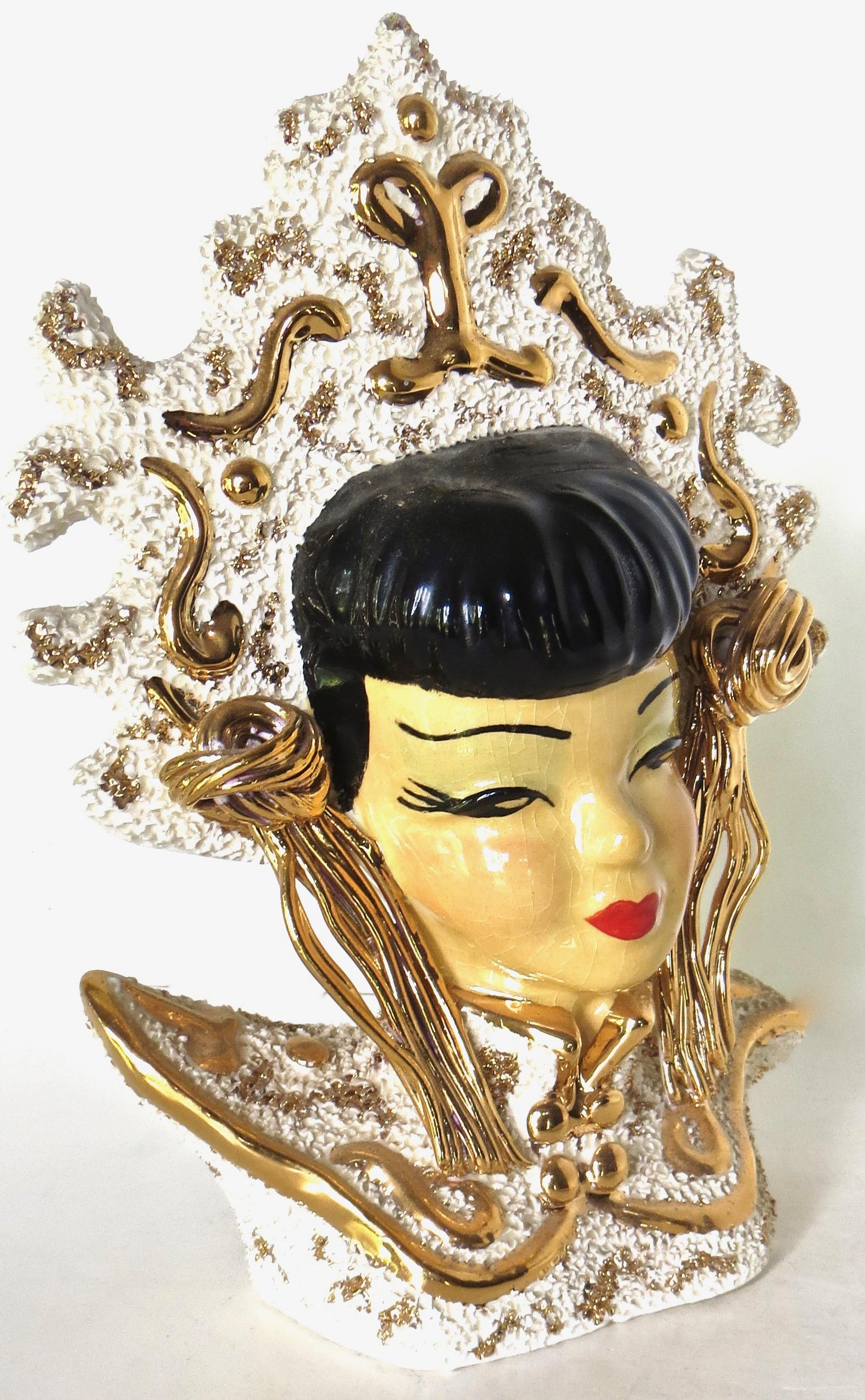 Hard to find and much sought after head vase; manufactured by the Tacoma Pottery Company (U.S.A.), circa late 1950's; depicts Japanese young lady dressed in formal traditional Japanese royal attire, with elaborate headdress and striking 
