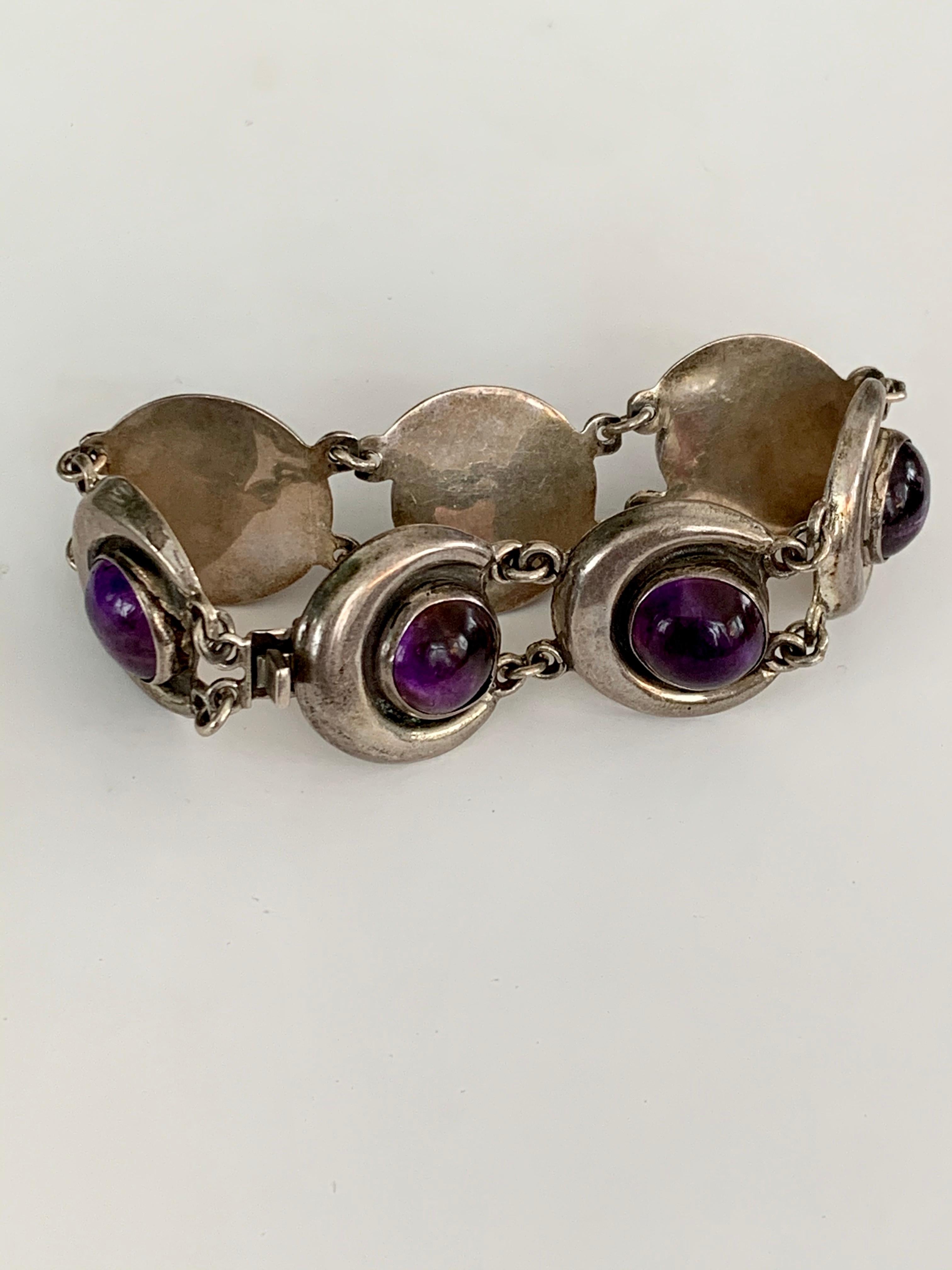 This vintage FARFAN Mexican Silver bracelet features seven cabochon Amethyst stones; one per link.  Each Amethyst is 1/2
