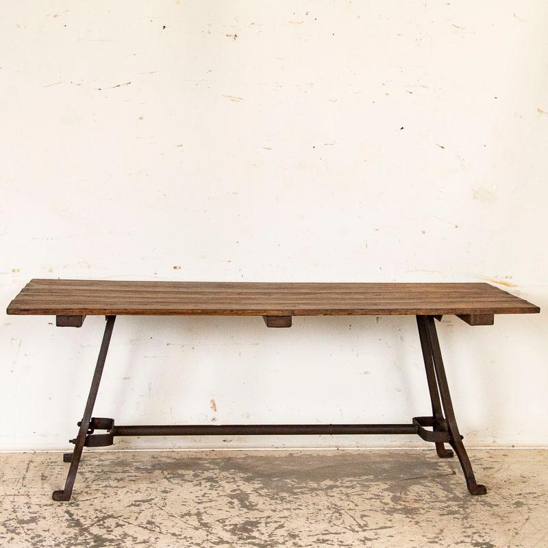 Authentic vintage farm table with heavy cast iron legs that create the perfect 