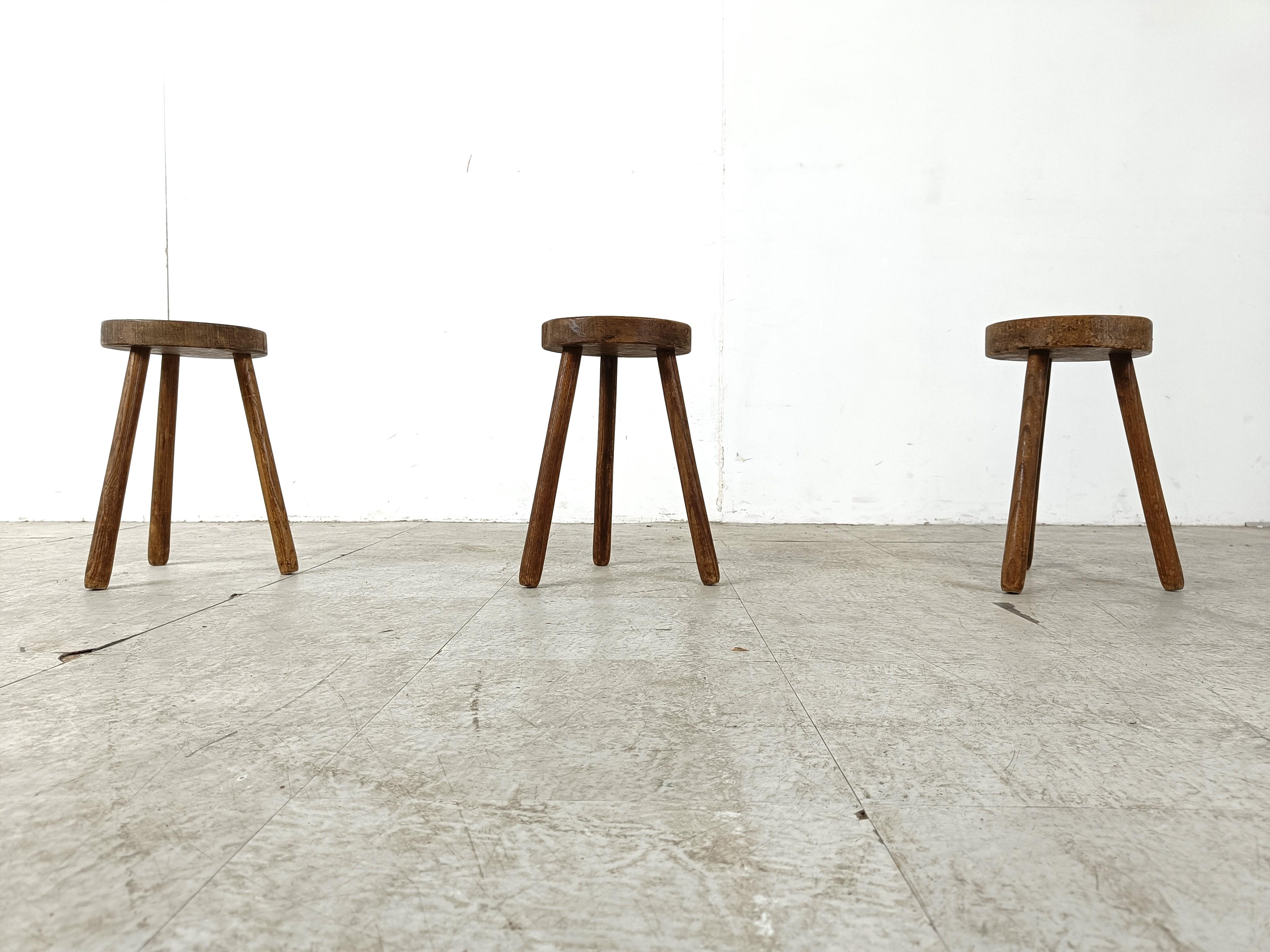 Primitive handmade oak farm stools, set of 3 

Timeless, decorative piece

1950s - France

Good condition

Dimensions:
Height: 35cm/13.77
