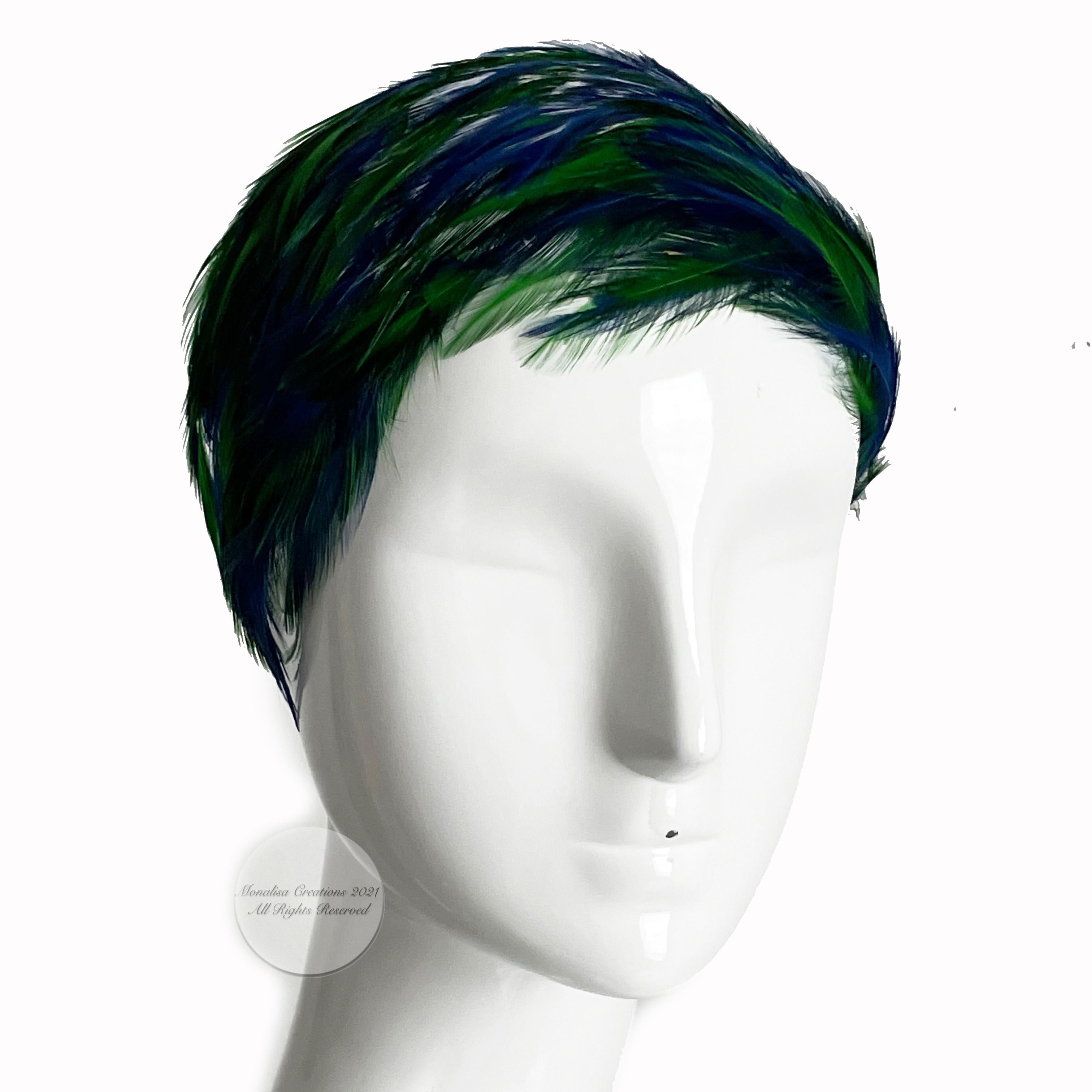 Vintage, preowned fascinator hat with peacock color feathers, likely made in the 40s. Gorgeous colors on this one (reminds us of the piece Carrie Bradshaw wore for her wedding to Big in the Sex & The City Movie)!! 

Preowned/vintage with some signs