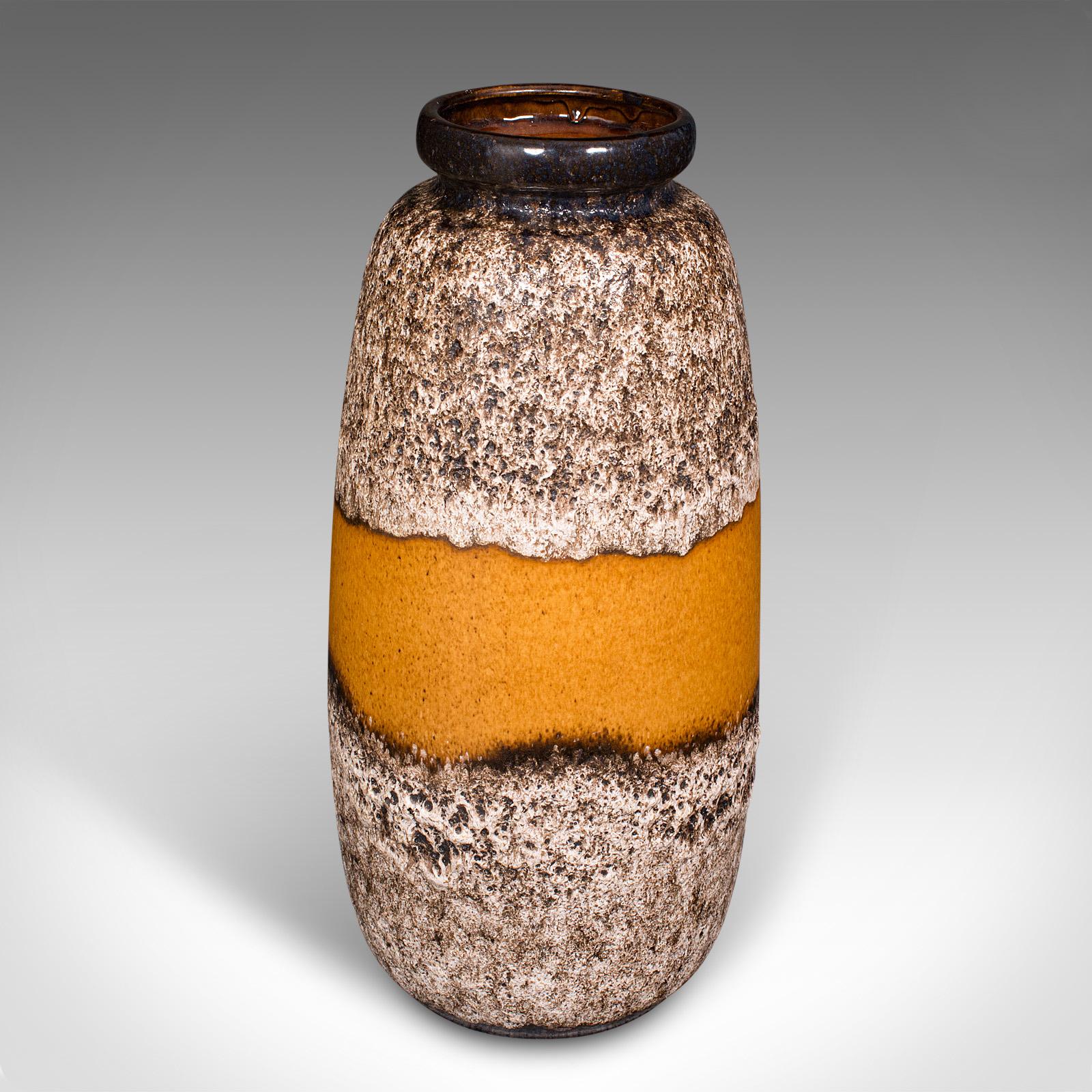 This is a vintage fat lava vase. A German, ceramic magma finish stick stand, dating to the mid 20th century, circa 1950.

Distinctive finish with appealing colour and of useful proportion for hall use
Displays a desirable aged patina and good